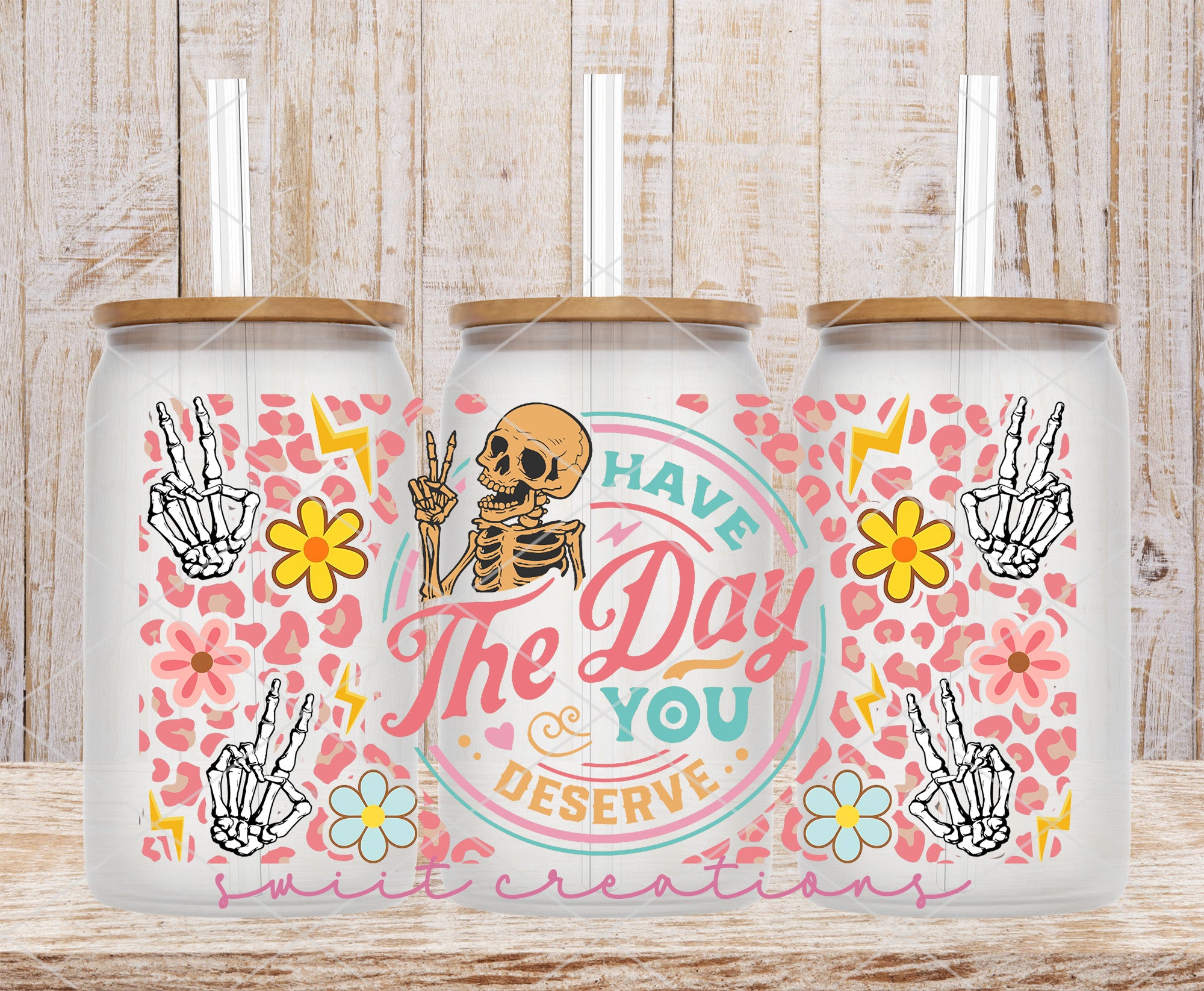 a couple of cups that have a skeleton on them