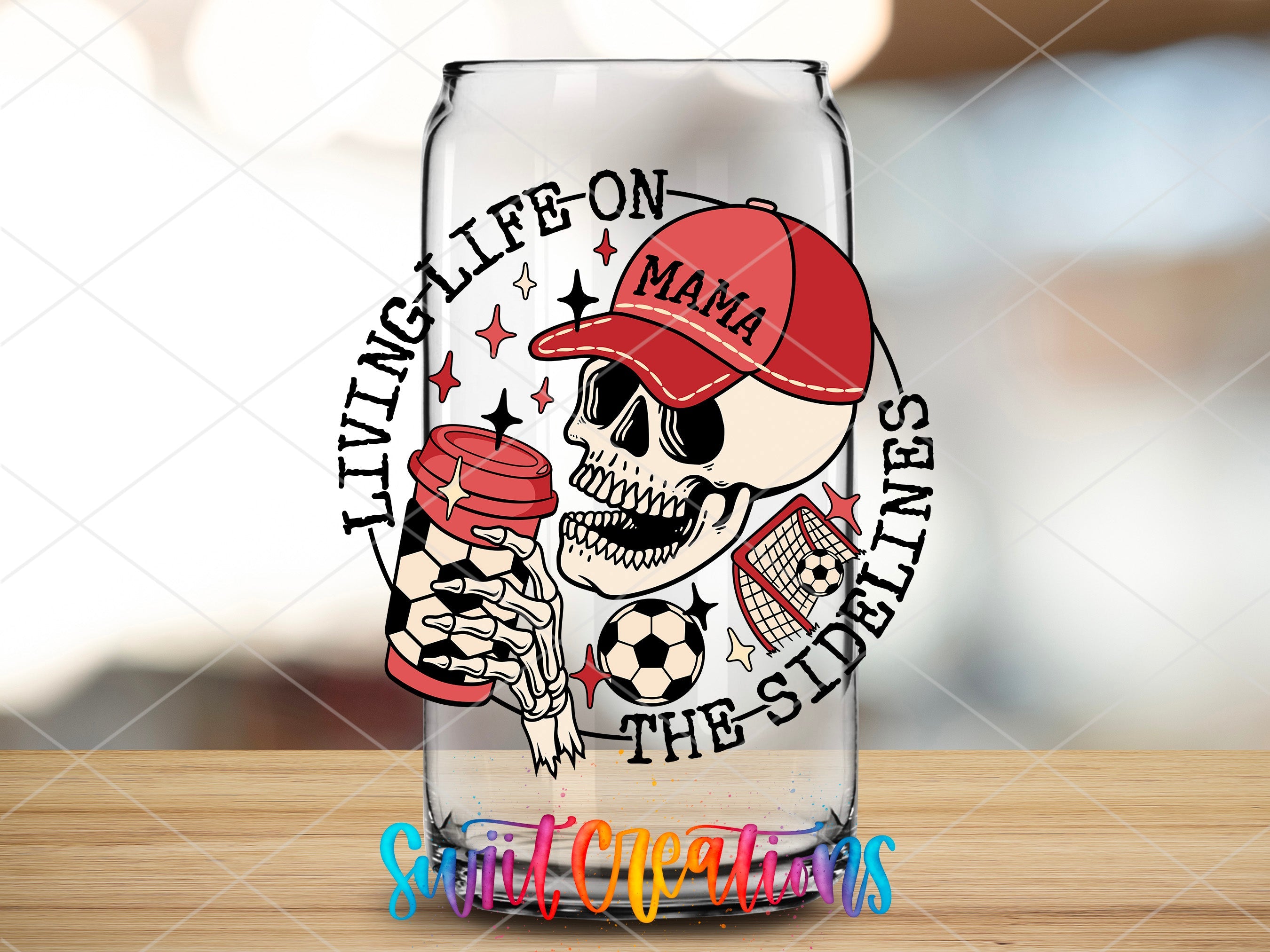 a glass with a skull holding a soccer ball