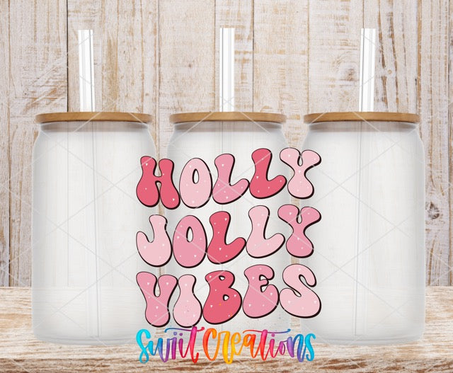 two coffee mugs with the words holly jolly vibes on them