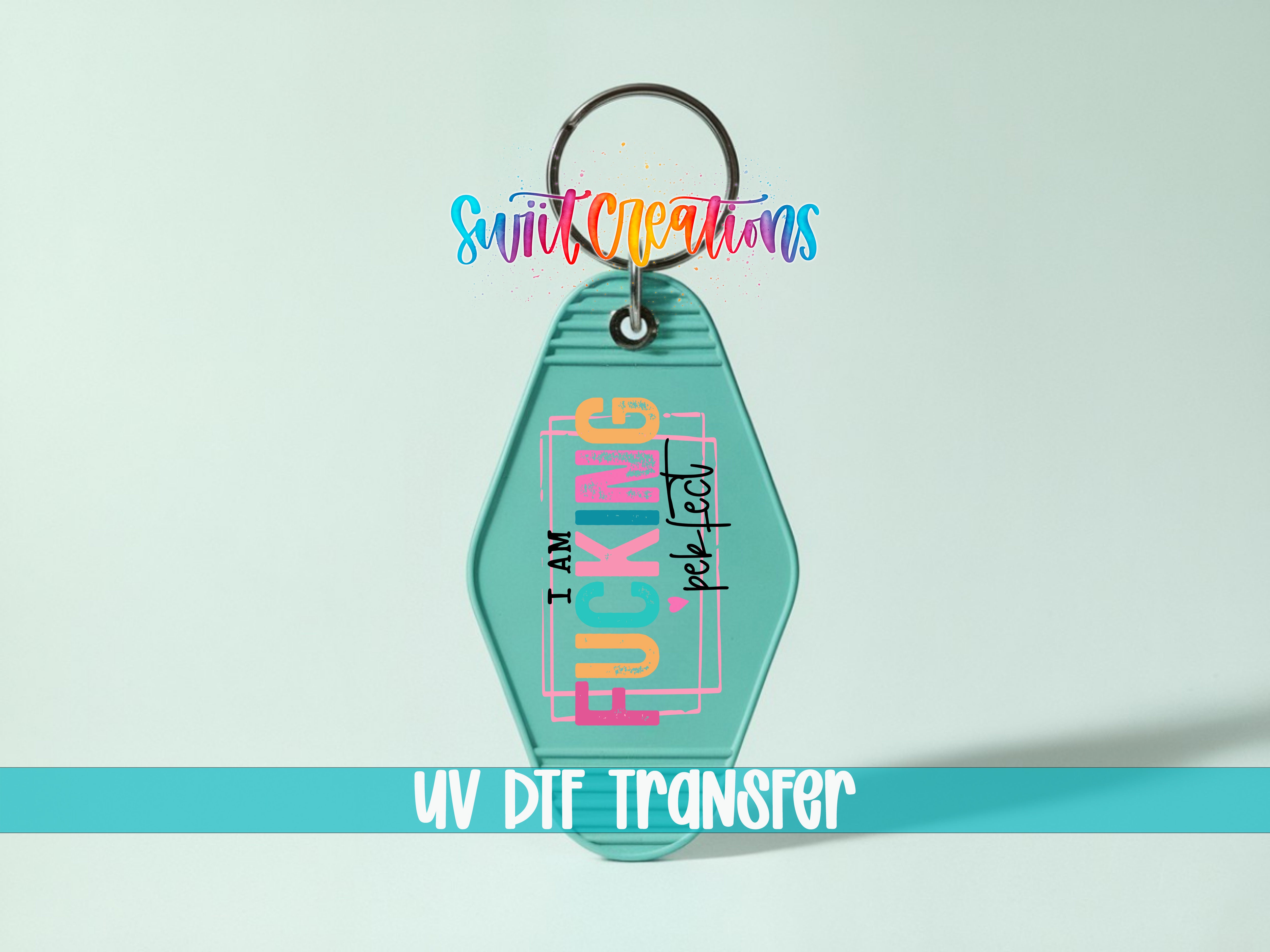 A keychain with a colorful design and text on it, along with a UV DIF transfer label.