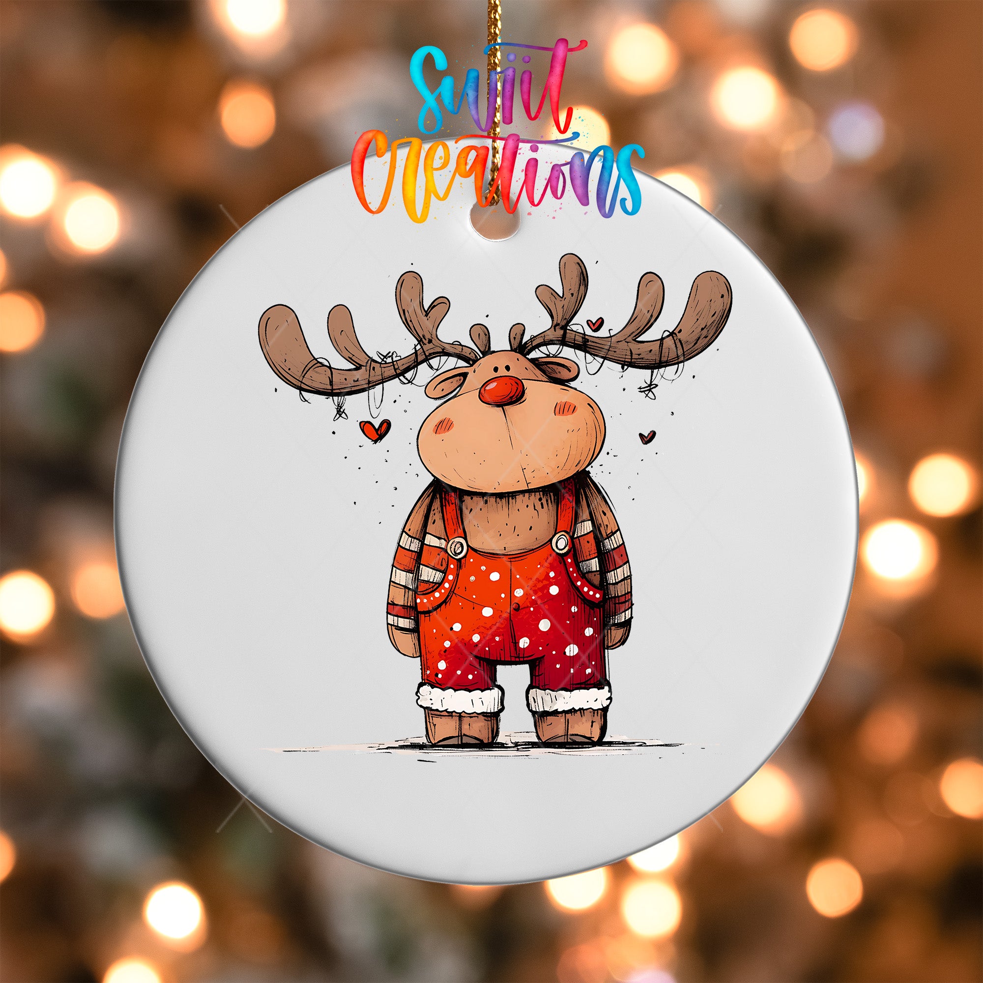 A white ornament featuring a cartoon reindeer with antlers and a red nose, wearing overalls with white polka dots.