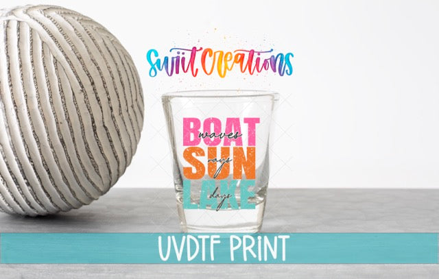 a ball of yarn next to a glass of water