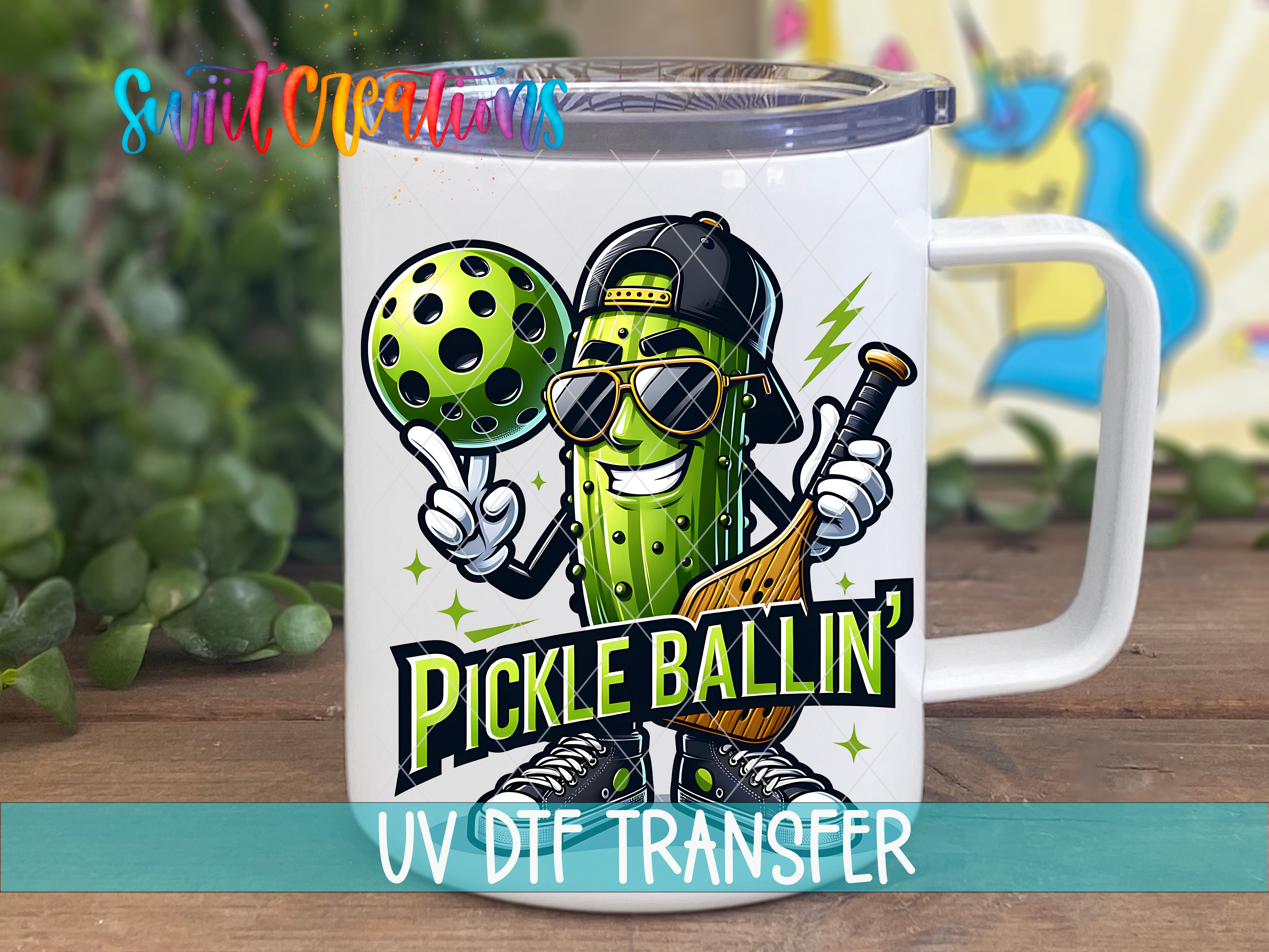 A mug with a cartoon image of a pickle wearing sunglasses and holding a baseball bat, with the text "Pickle Ballin'".