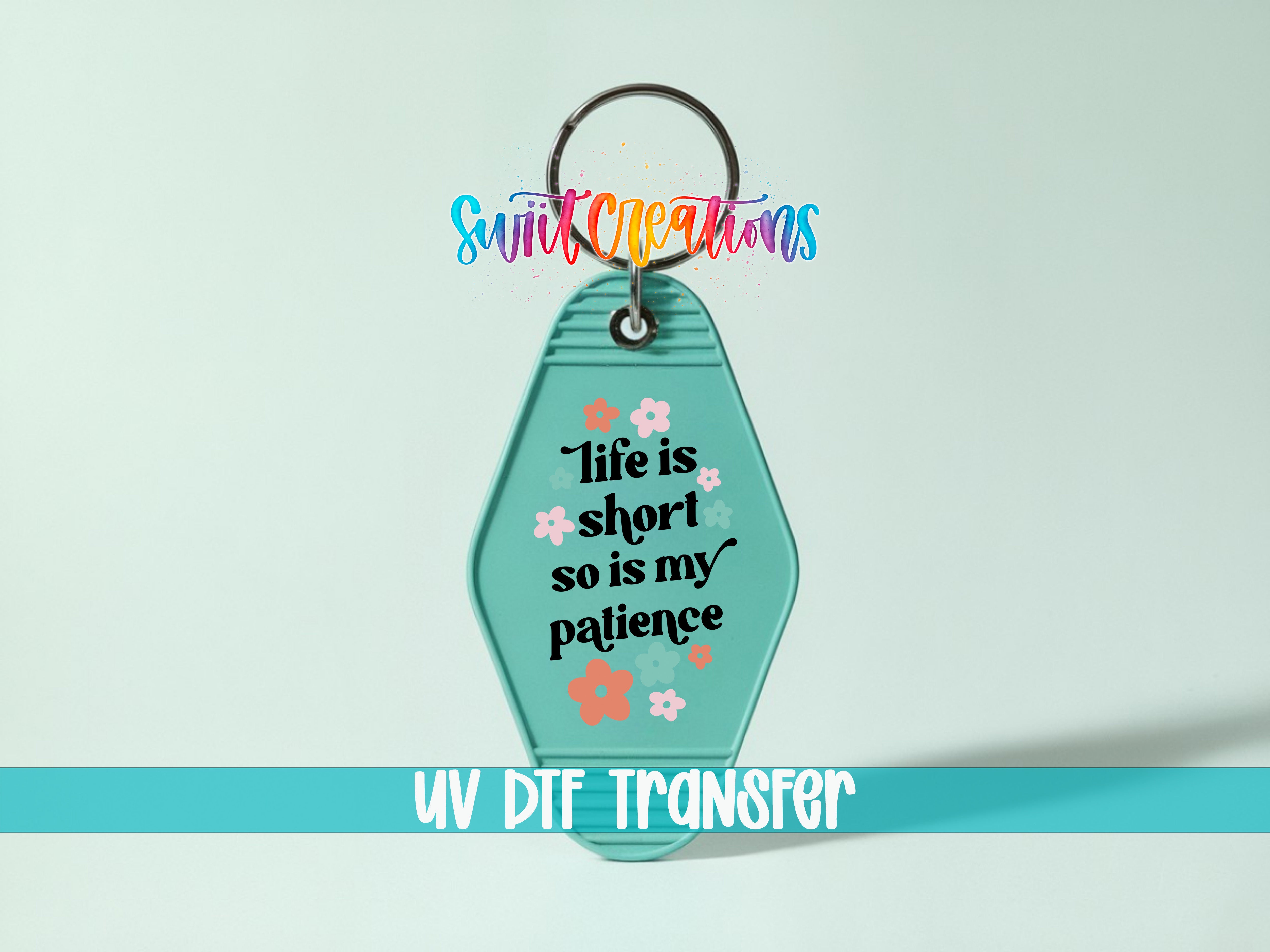A keychain with a message that says "Life is short so is my patience" and some flowers on it.