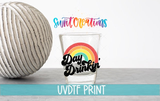 a ball of yarn next to a glass of water