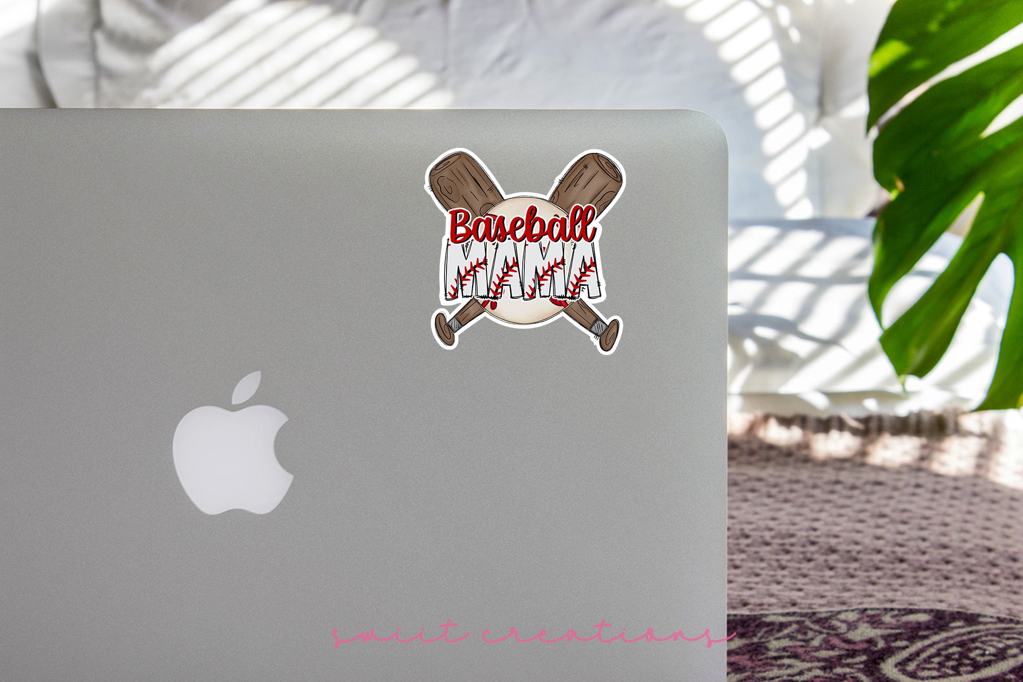 a laptop with a sticker of baseball bats