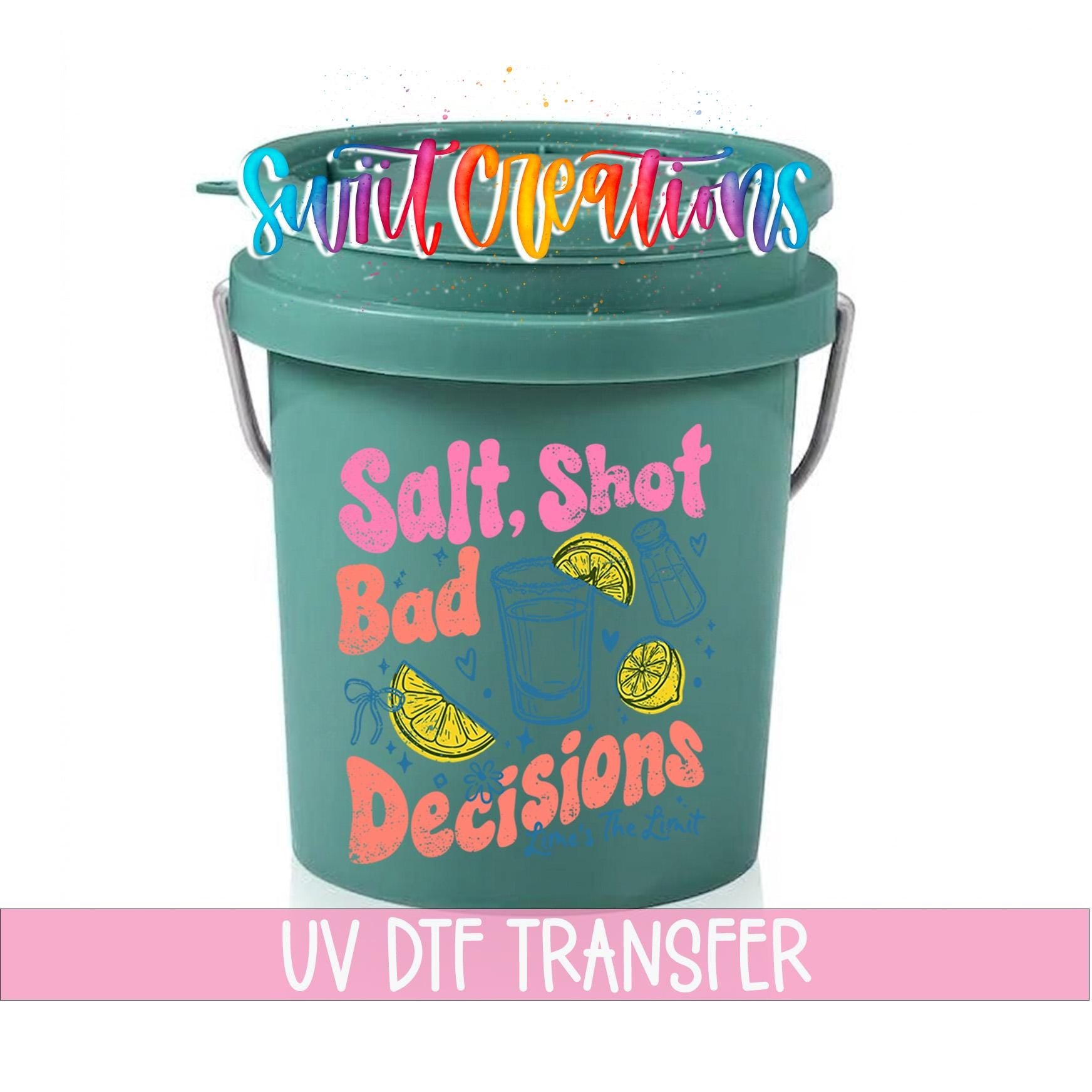 A green bucket with a colorful design and text printed on it.