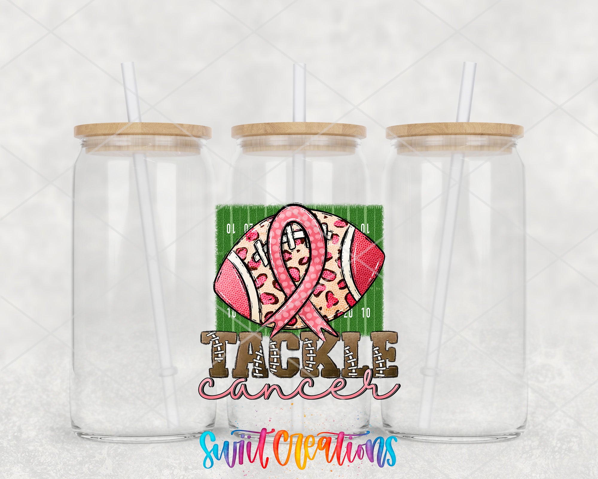 two clear plastic cups with a pink ribbon on them