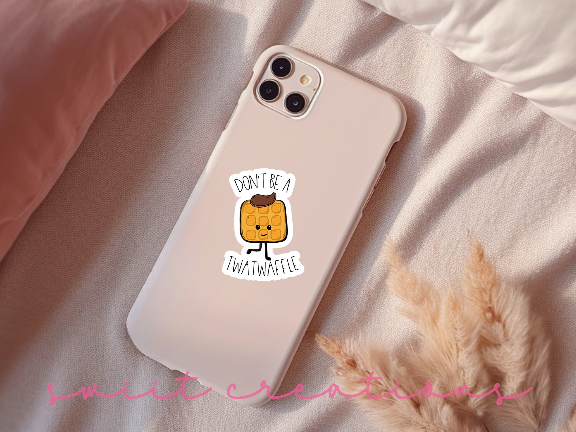 a phone case sitting on top of a bed