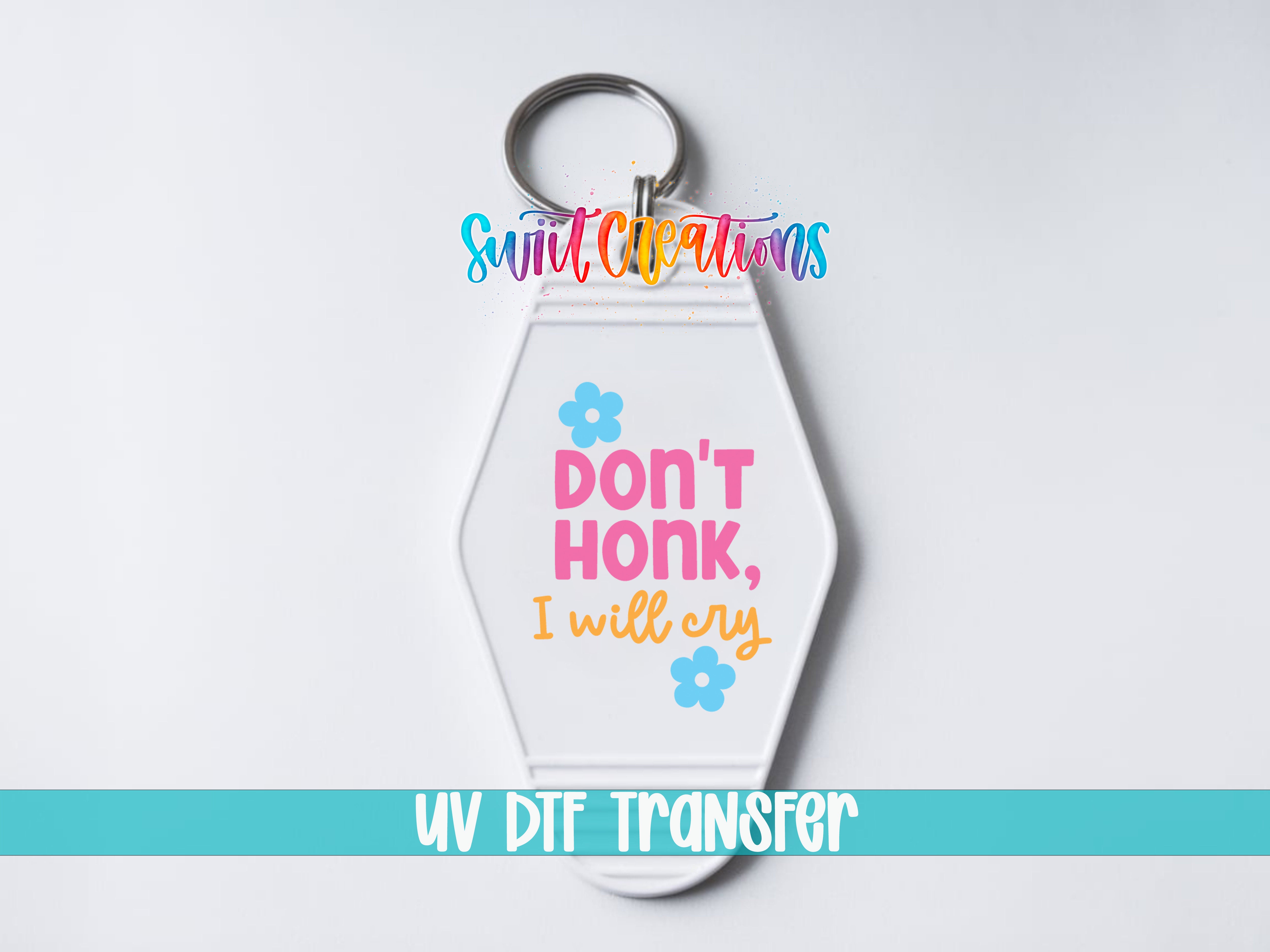 A keychain with a message printed on it.