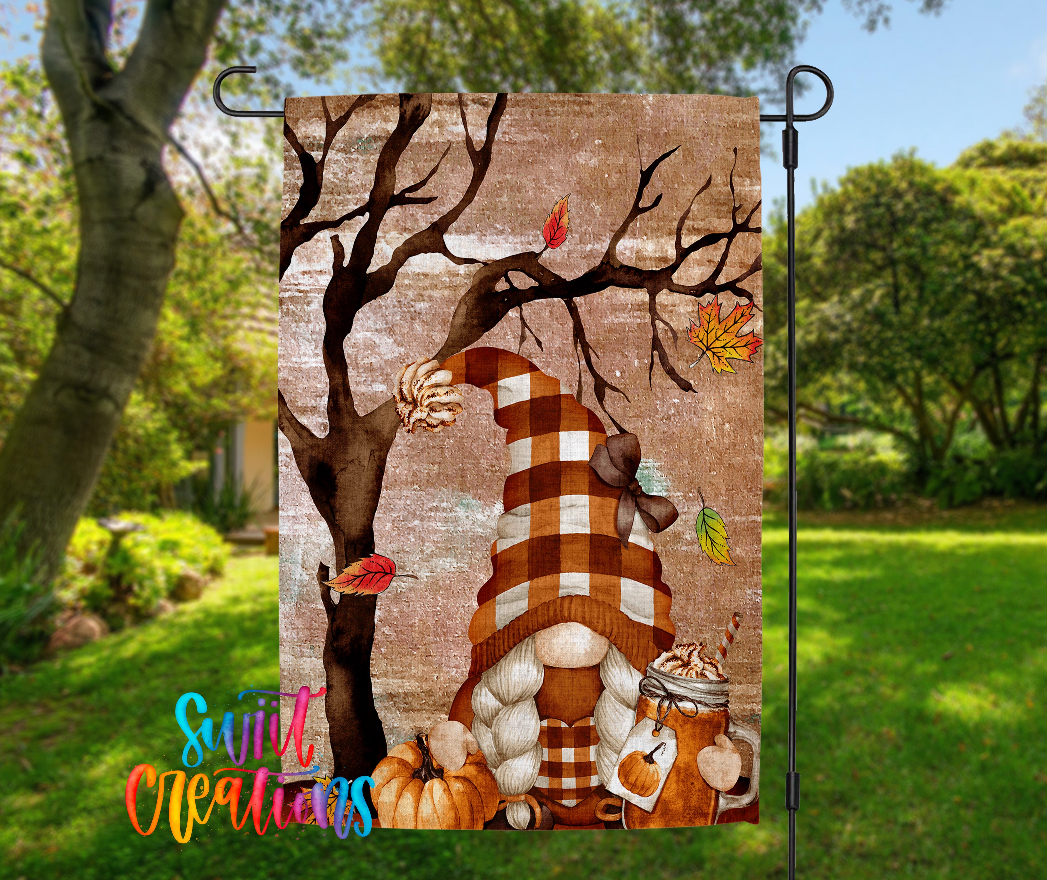 A banner featuring a gnome holding a mug of hot chocolate and a pumpkin, with a tree and autumn leaves in the background.
