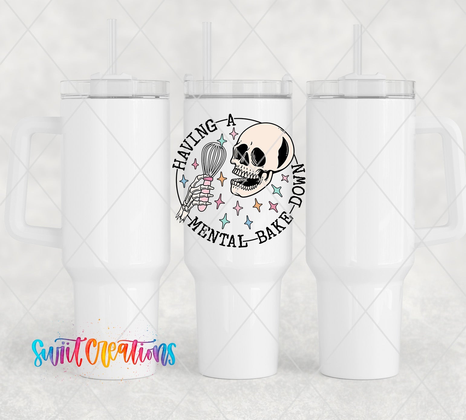 a white tumbler with a skull and a hot air balloon on it