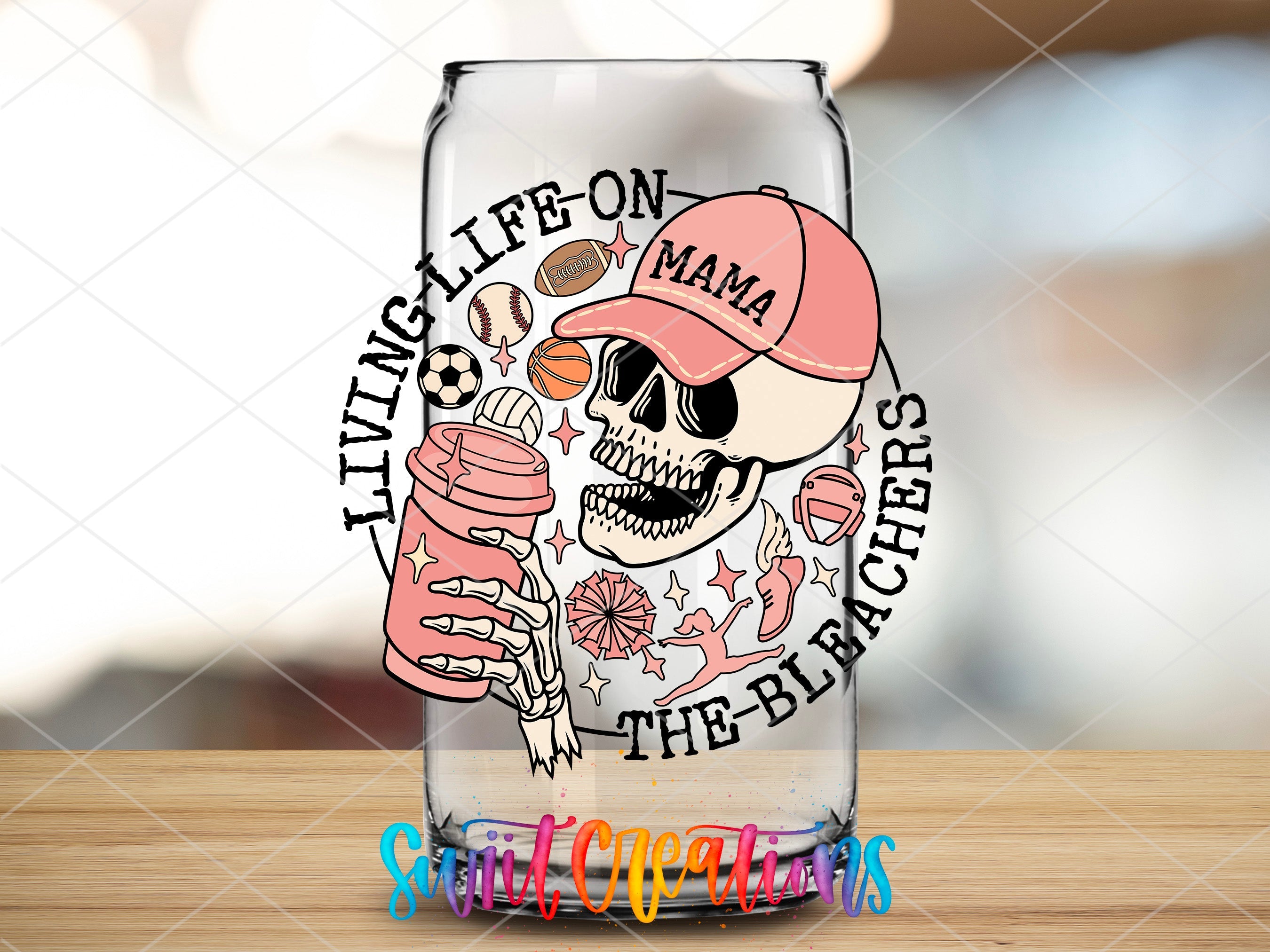 a glass with a skull and a baseball cap on it
