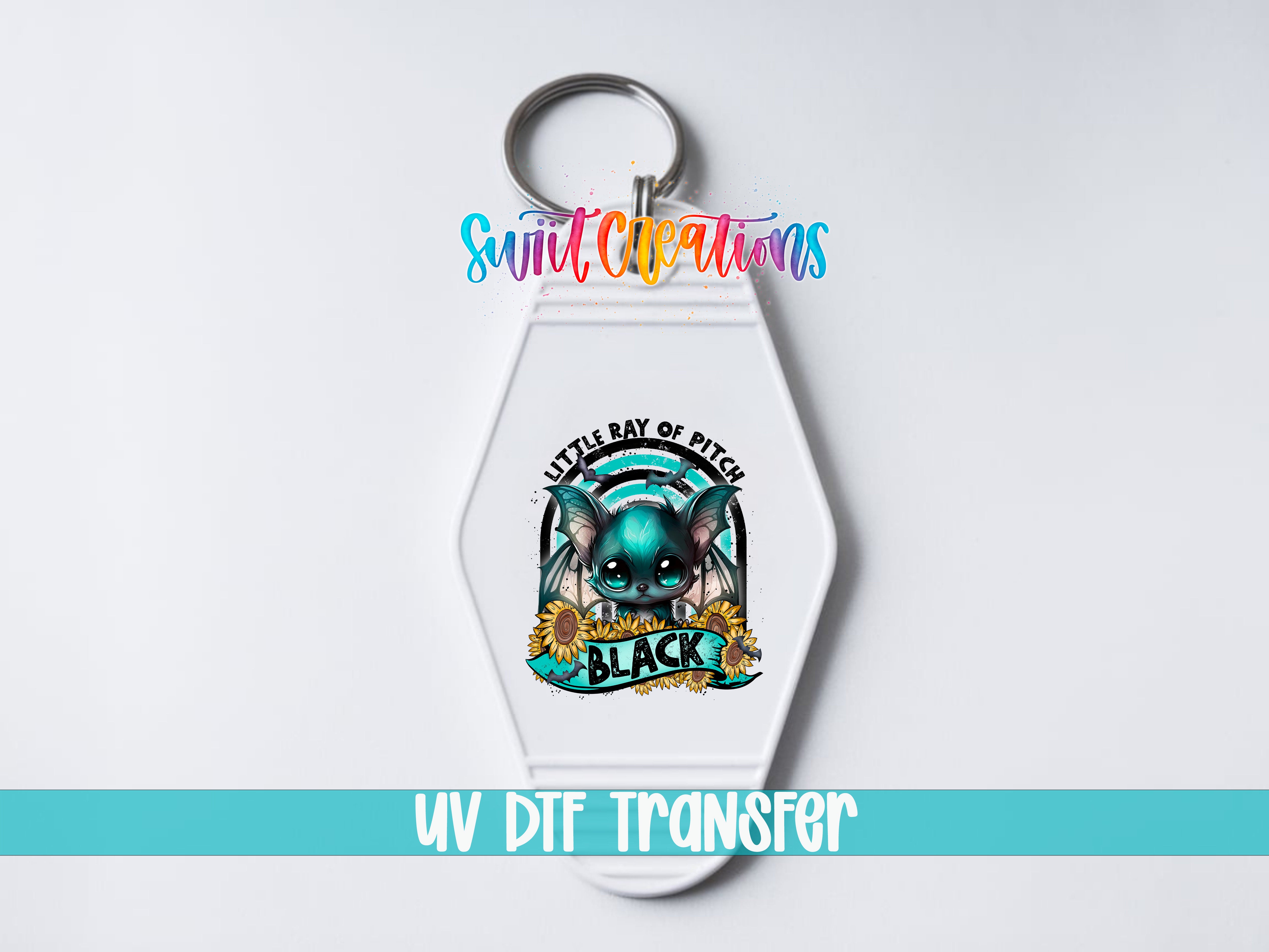 A keychain with a colorful design featuring a cartoon character and the text "Little Bay of Pitch" and "Black".