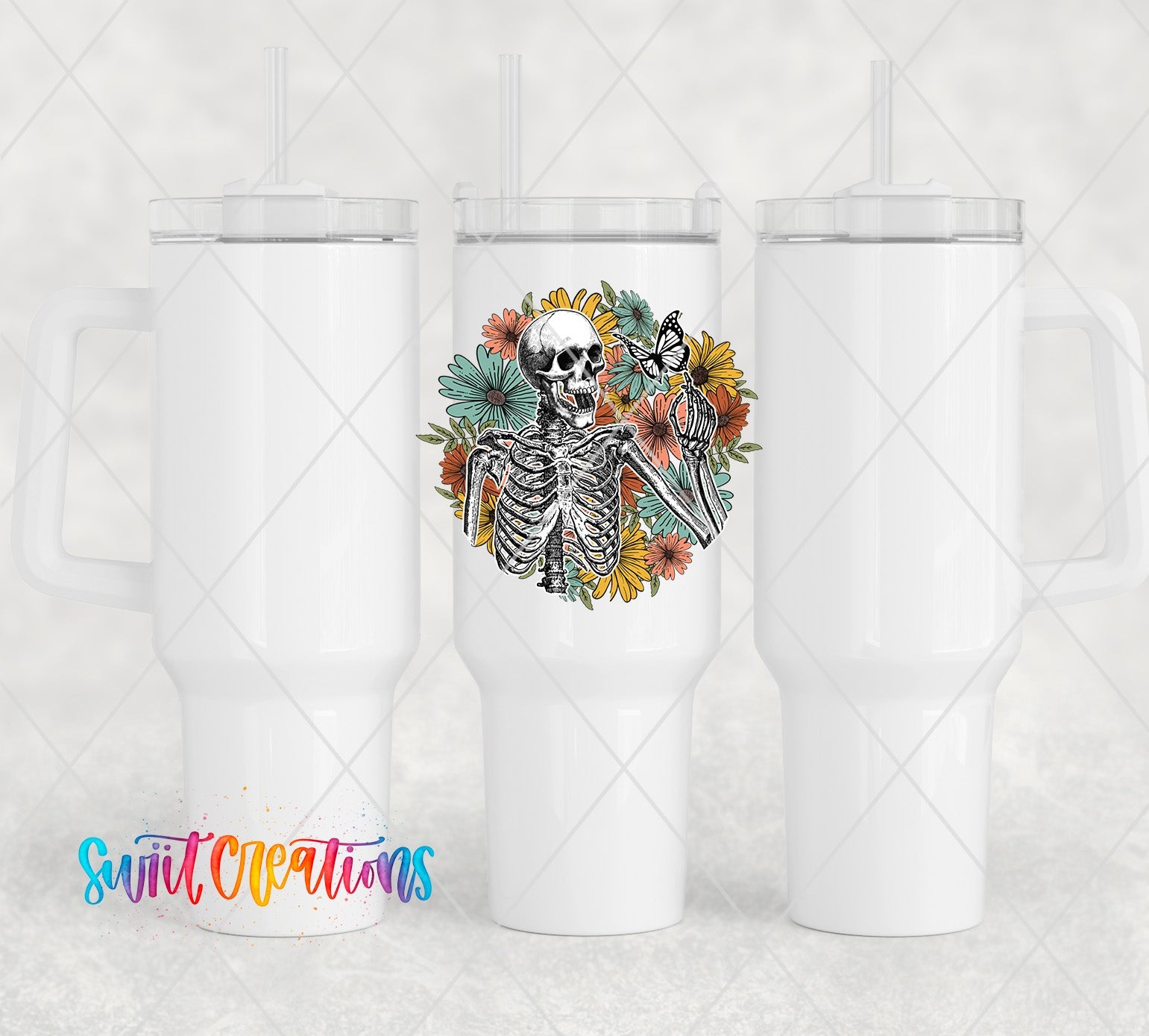 two white tumblers with a skeleton and flowers on them