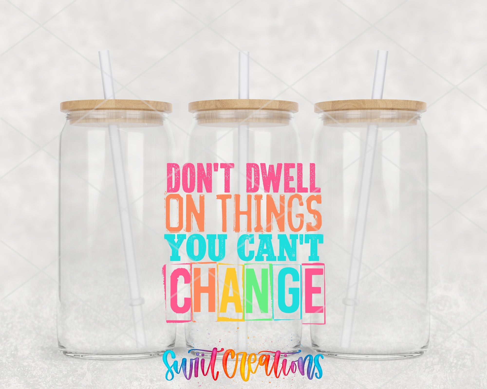 two tumblers with straw tops that say don't dwelll on things