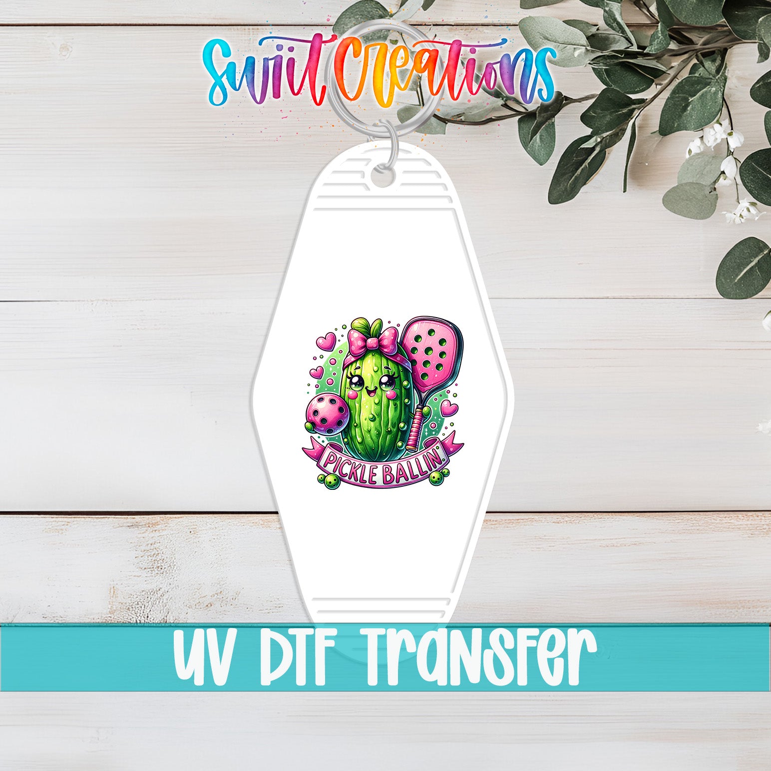 A keychain with a colorful illustration of a cactus and the text "Pickle Ball" printed on it, along with a UV DFT transfer label.