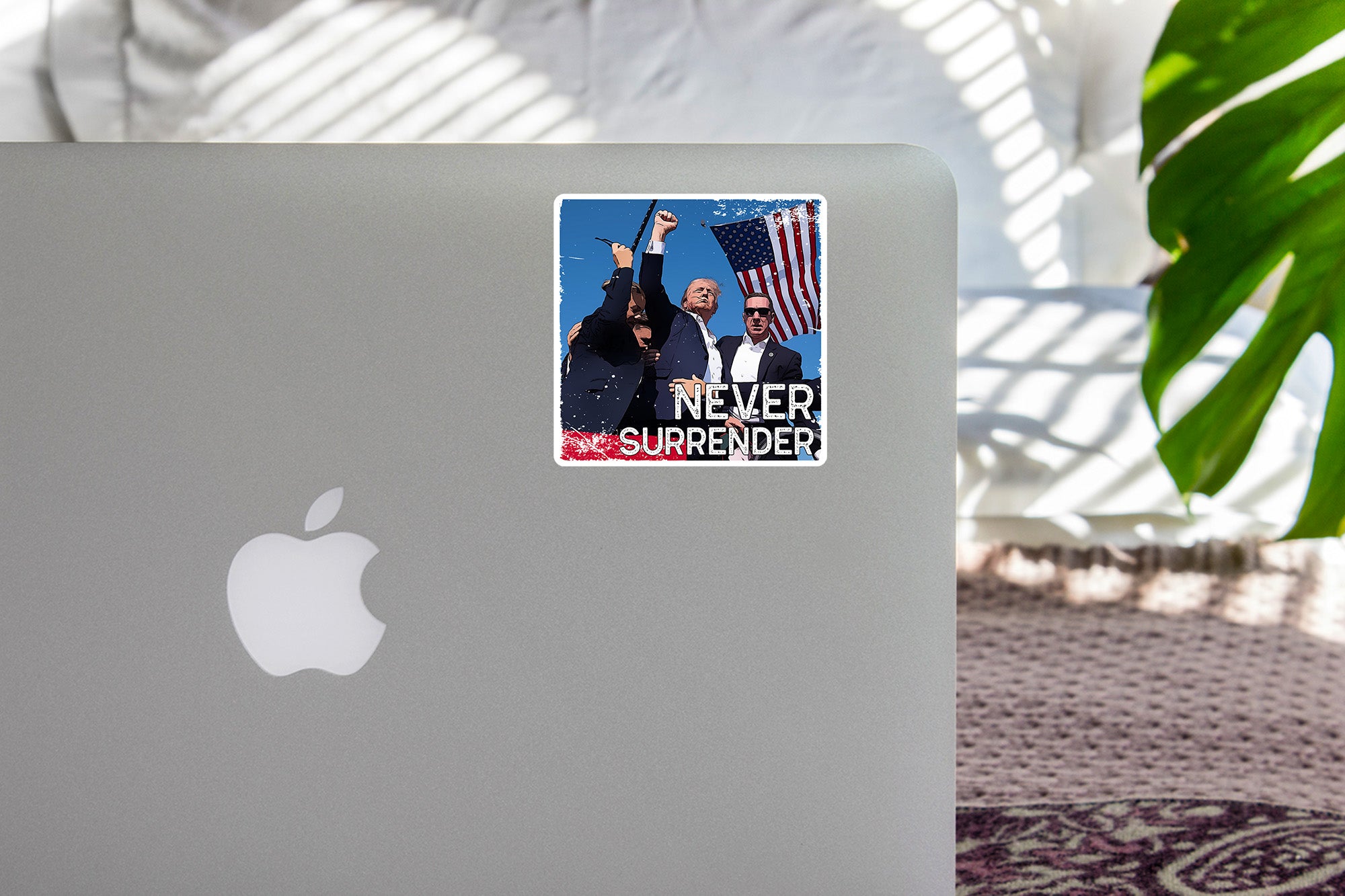 a laptop with a sticker of two people on it