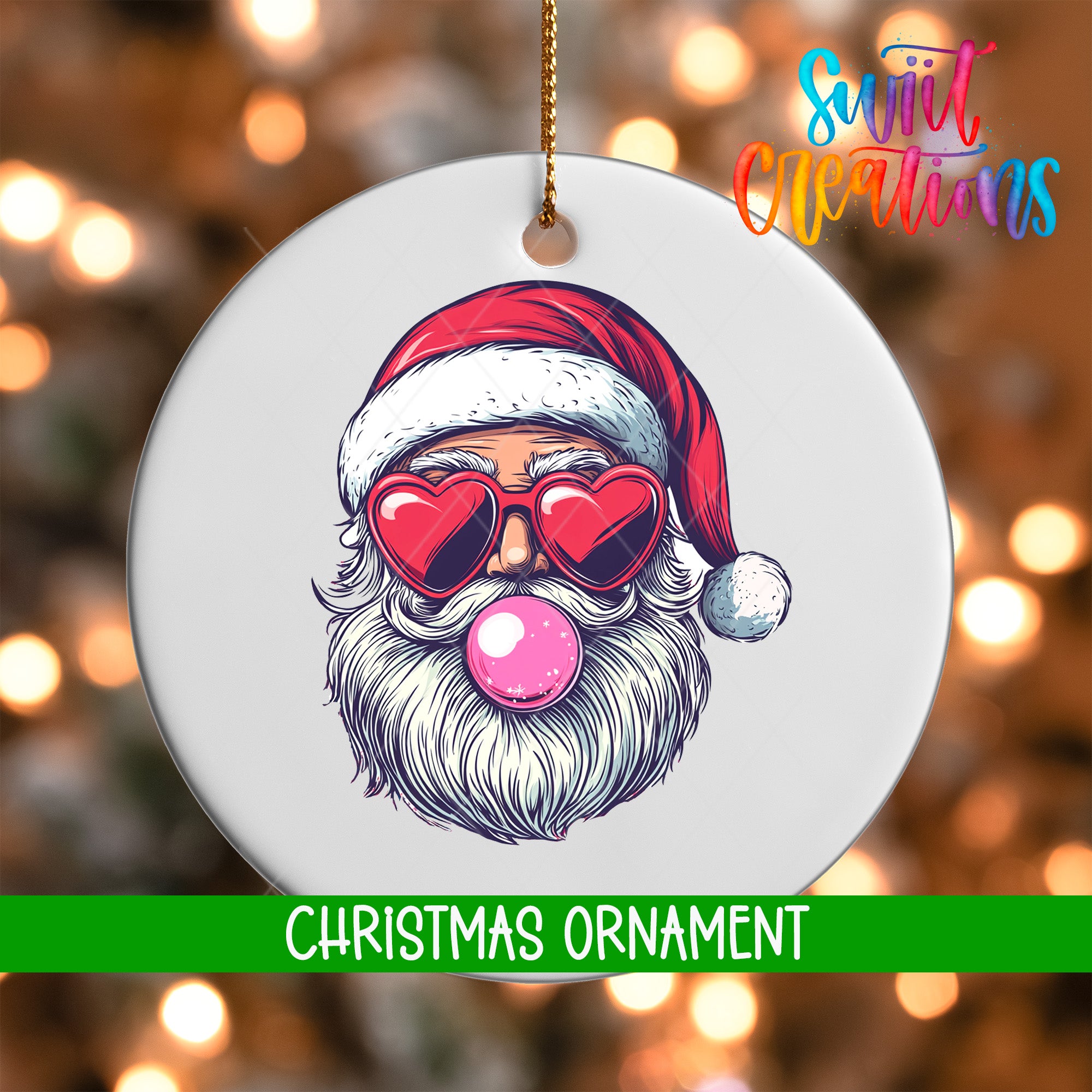A white Christmas ornament with a Santa Claus face wearing sunglasses and a red hat, with a pink bubble gum bubble in his mouth.