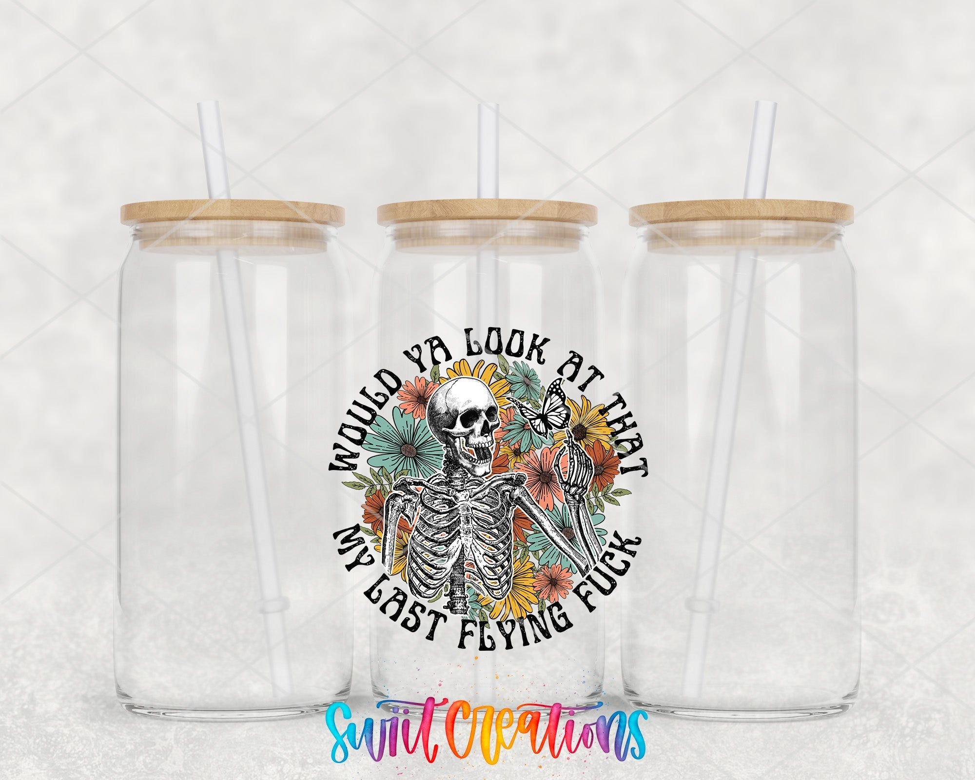 two clear tumblers with a skeleton and sunflowers on them