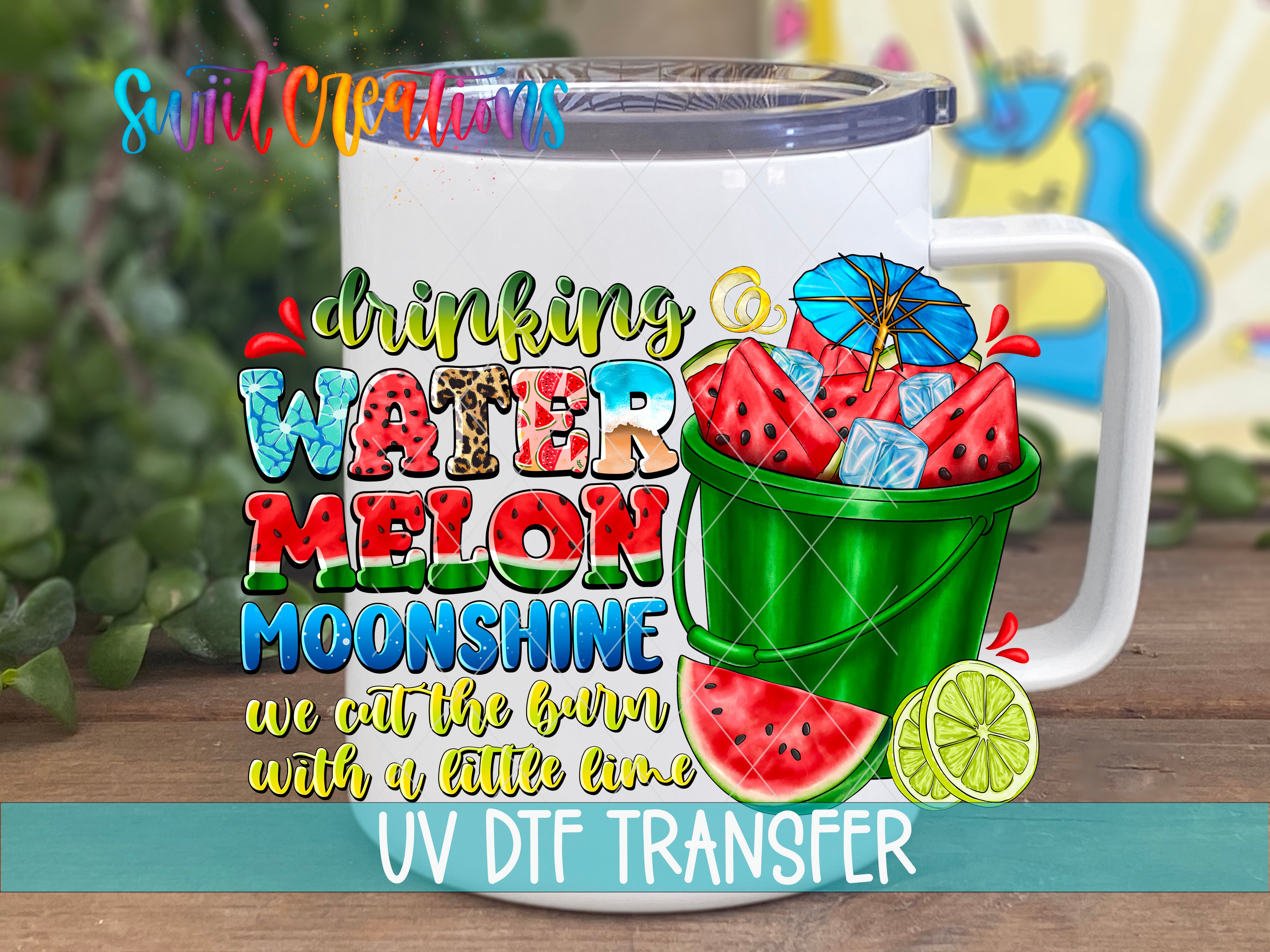 A white mug with a colorful design featuring a bucket filled with watermelon and a lemon slice, along with text that says "drinking watermelon moonshine we cut the barn with a little lime".