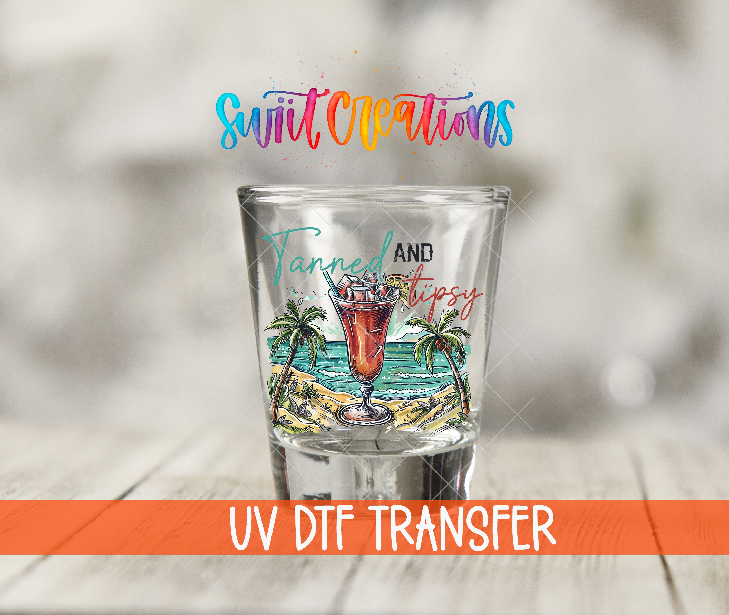 A shot glass with a tropical beach scene and palm trees, along with the text "Swift Creations" and "Tannes and Tipsy" printed on it.