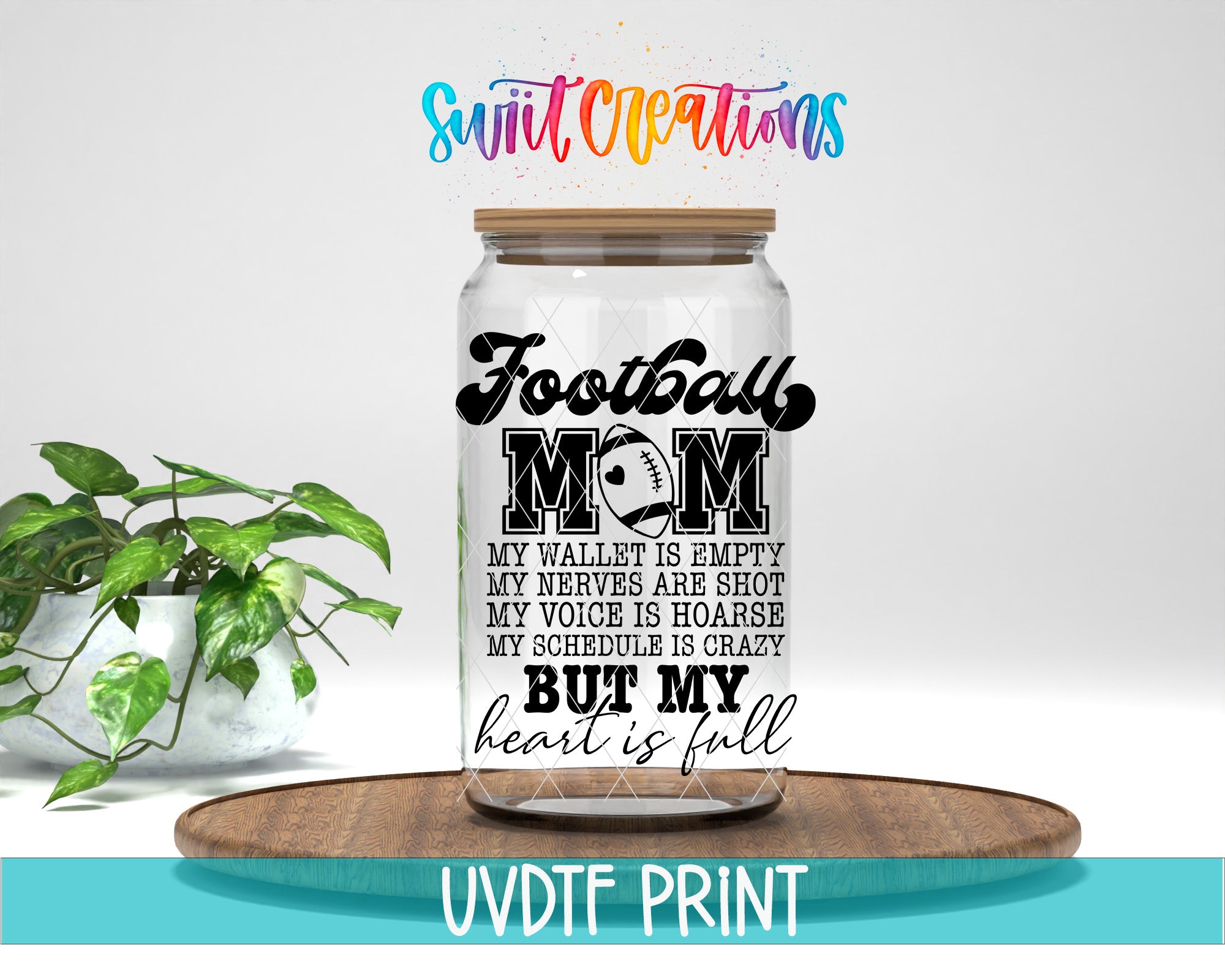 a mason jar with the words football mom on it