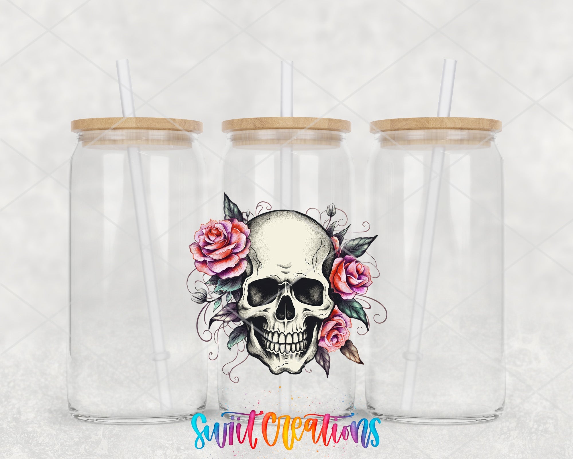 two clear tumblers with a skull and roses on them