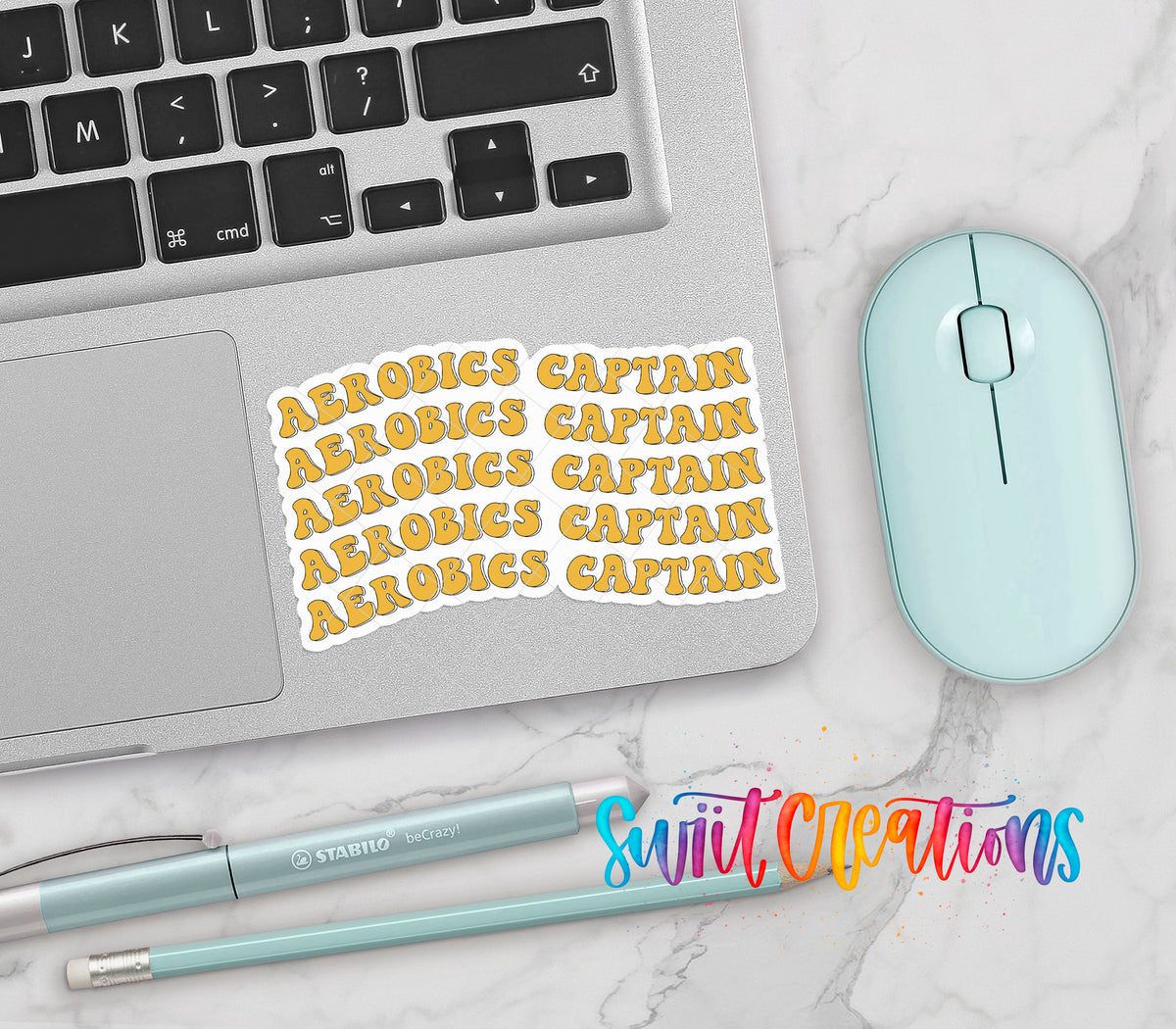 a laptop, a mouse, and various office supplies such as a pen and a pencil, all arranged on a marble surface.