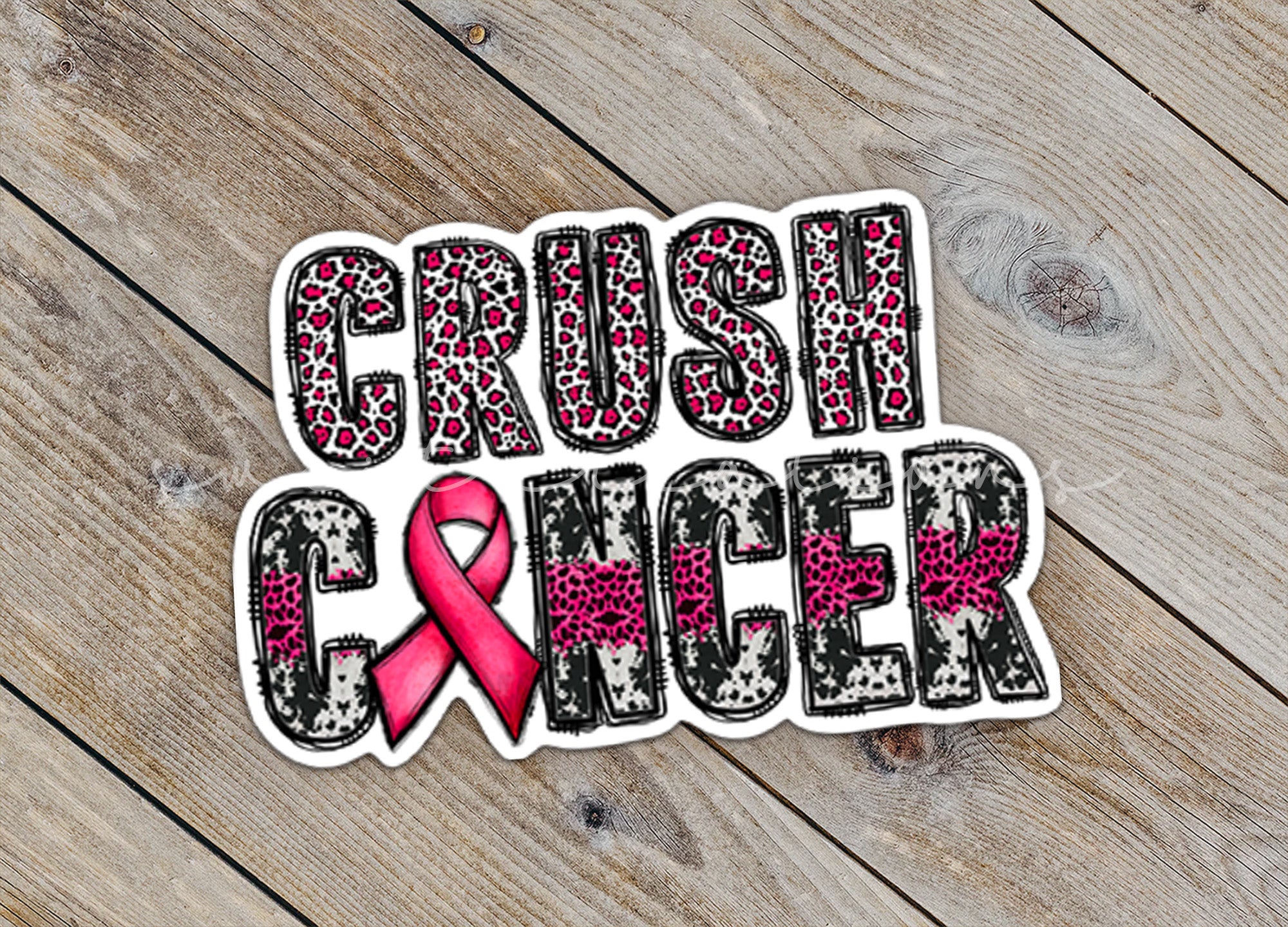 a sticker with a pink ribbon and leopard print