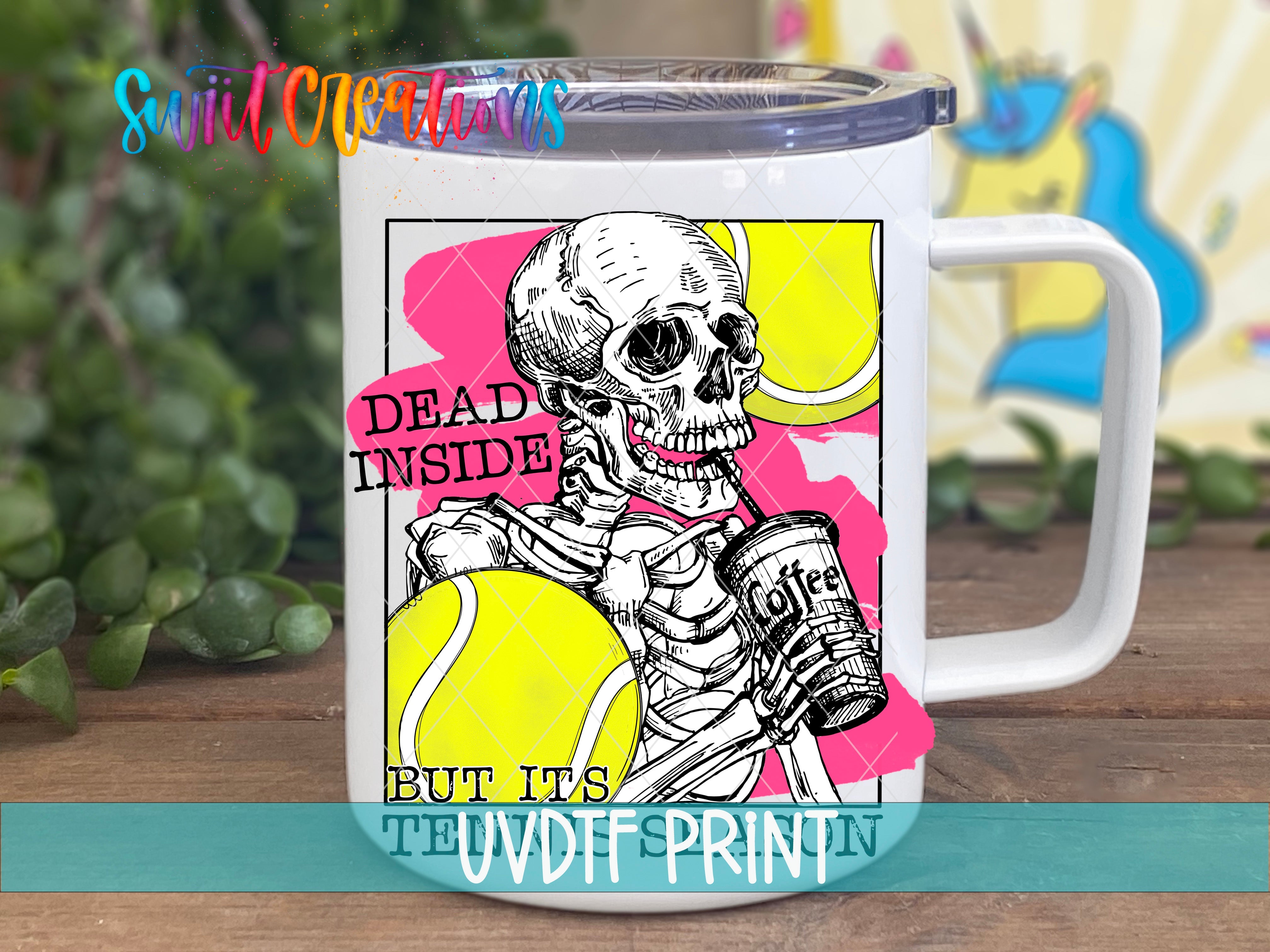 a white coffee mug with a skeleton holding a tennis ball