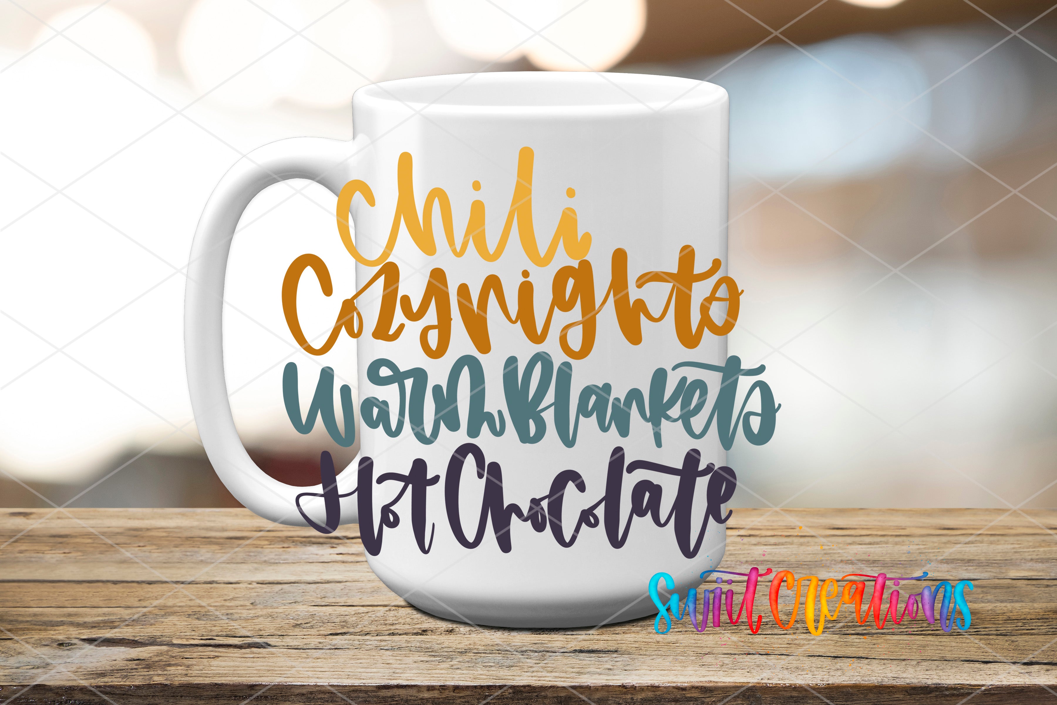 A white mug with colorful text printed on it, sitting on a wooden surface.