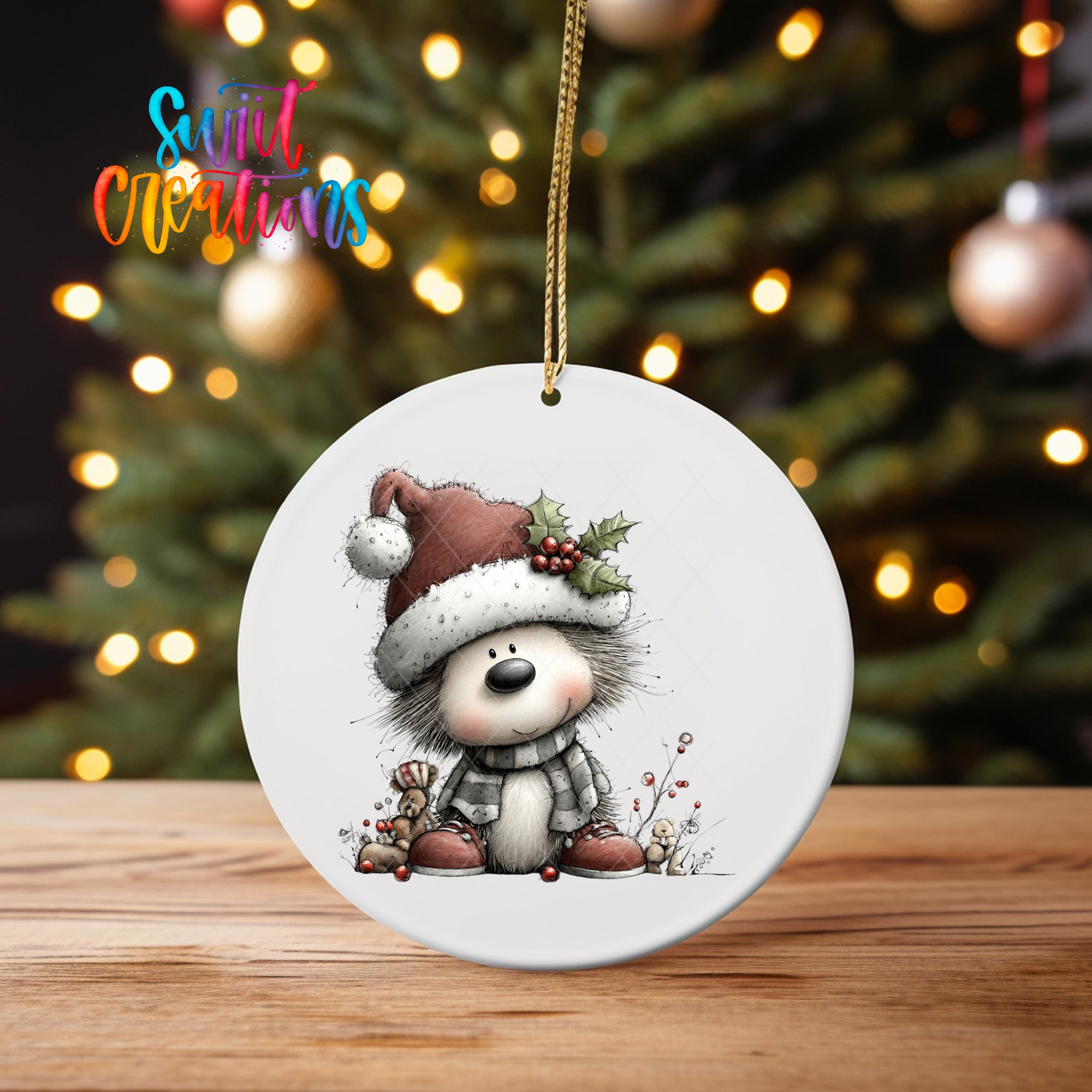A white ceramic ornament featuring a cartoon illustration of a dog wearing a Santa hat and scarf, sitting on a wooden surface with a blurred background of Christmas lights.