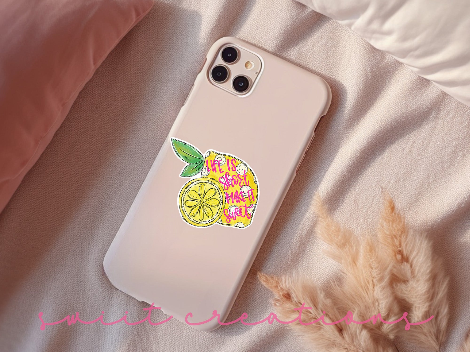a phone case sitting on top of a bed