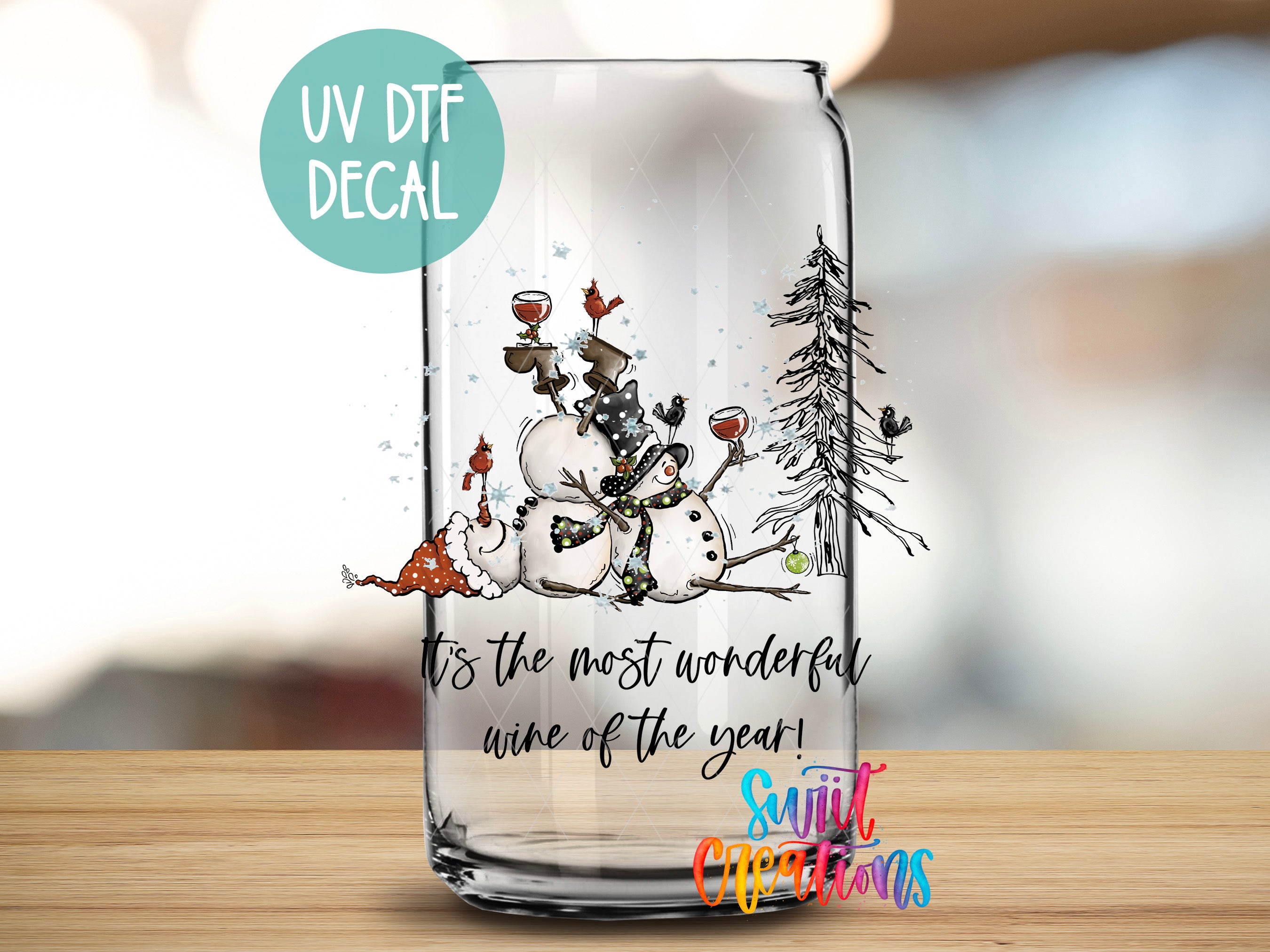 a glass with a picture of a snowman on it