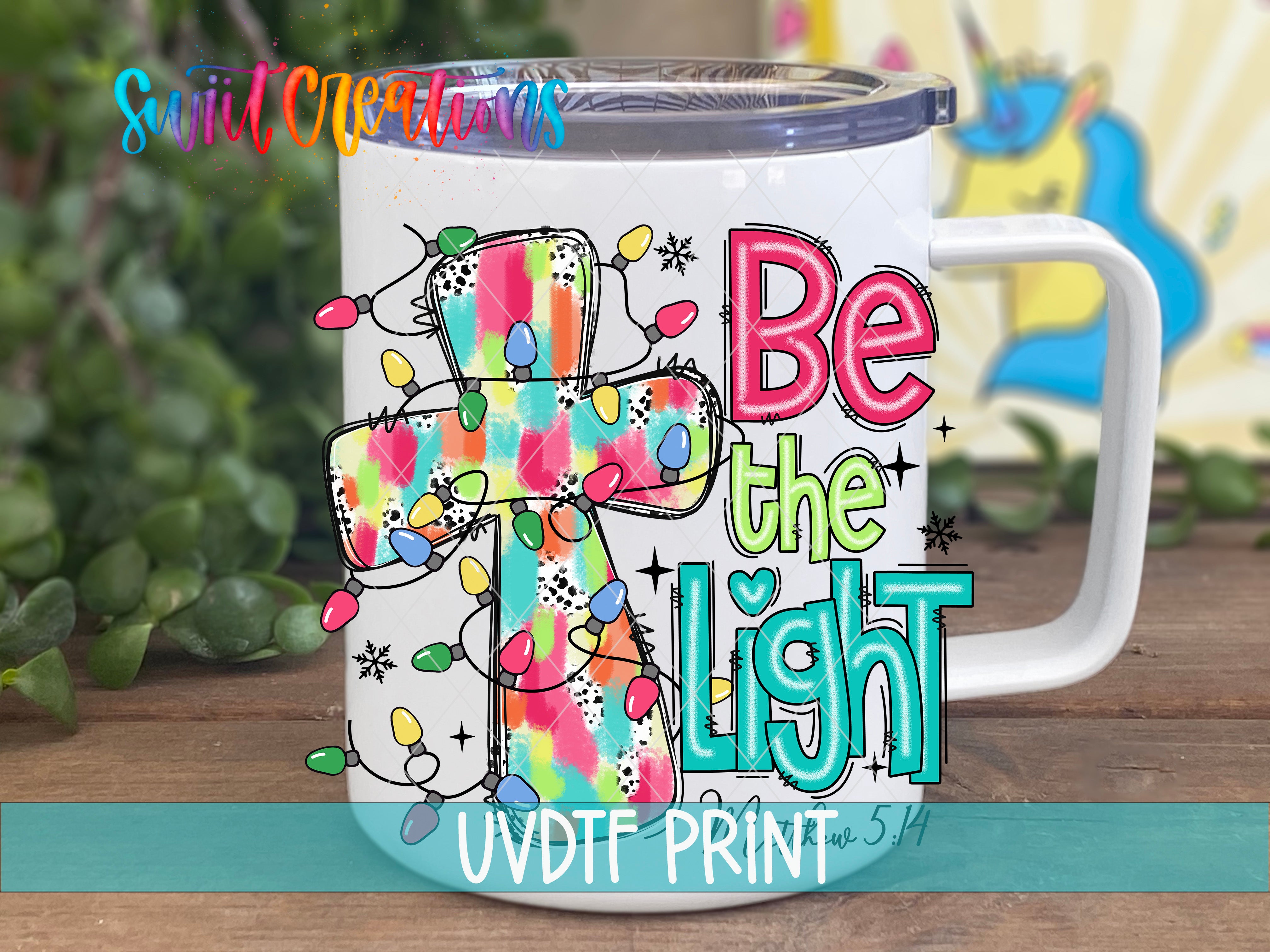 a white coffee mug with the words be the light on it