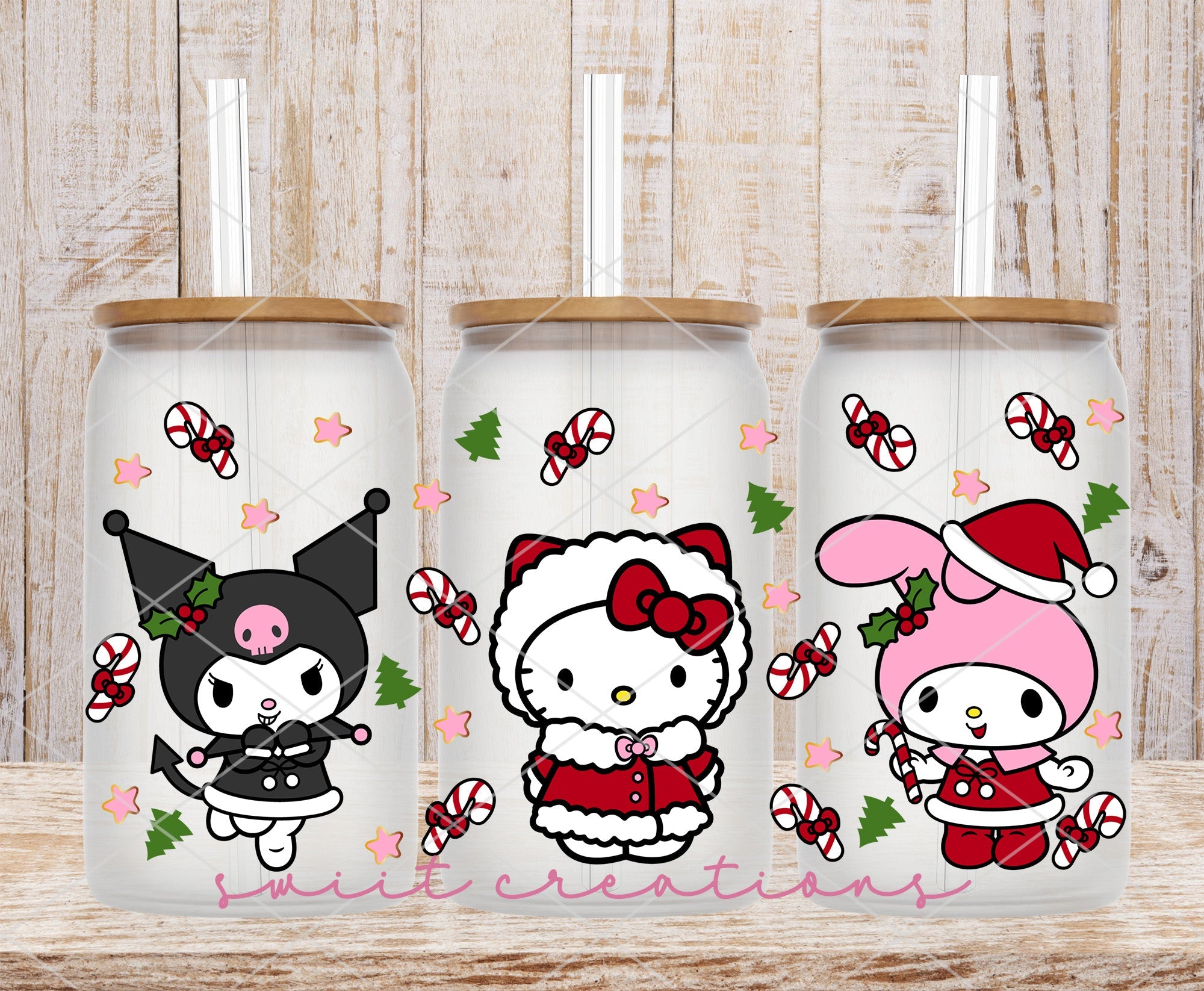 a couple of hello kitty tumblers sitting on top of a wooden table