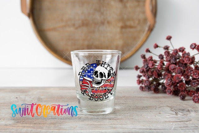 a shot glass with a skull and american flag on it
