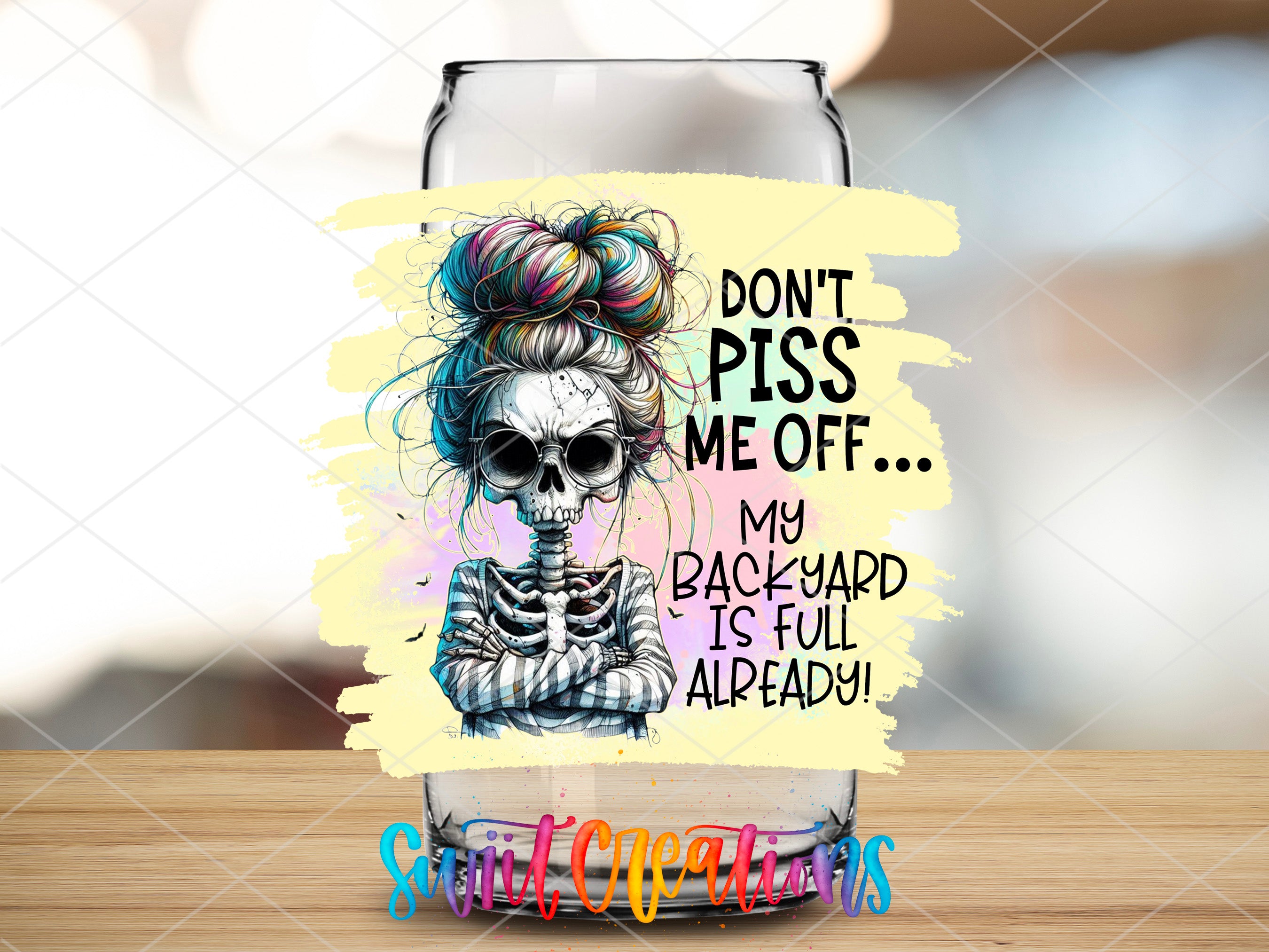a glass with a picture of a skeleton on it