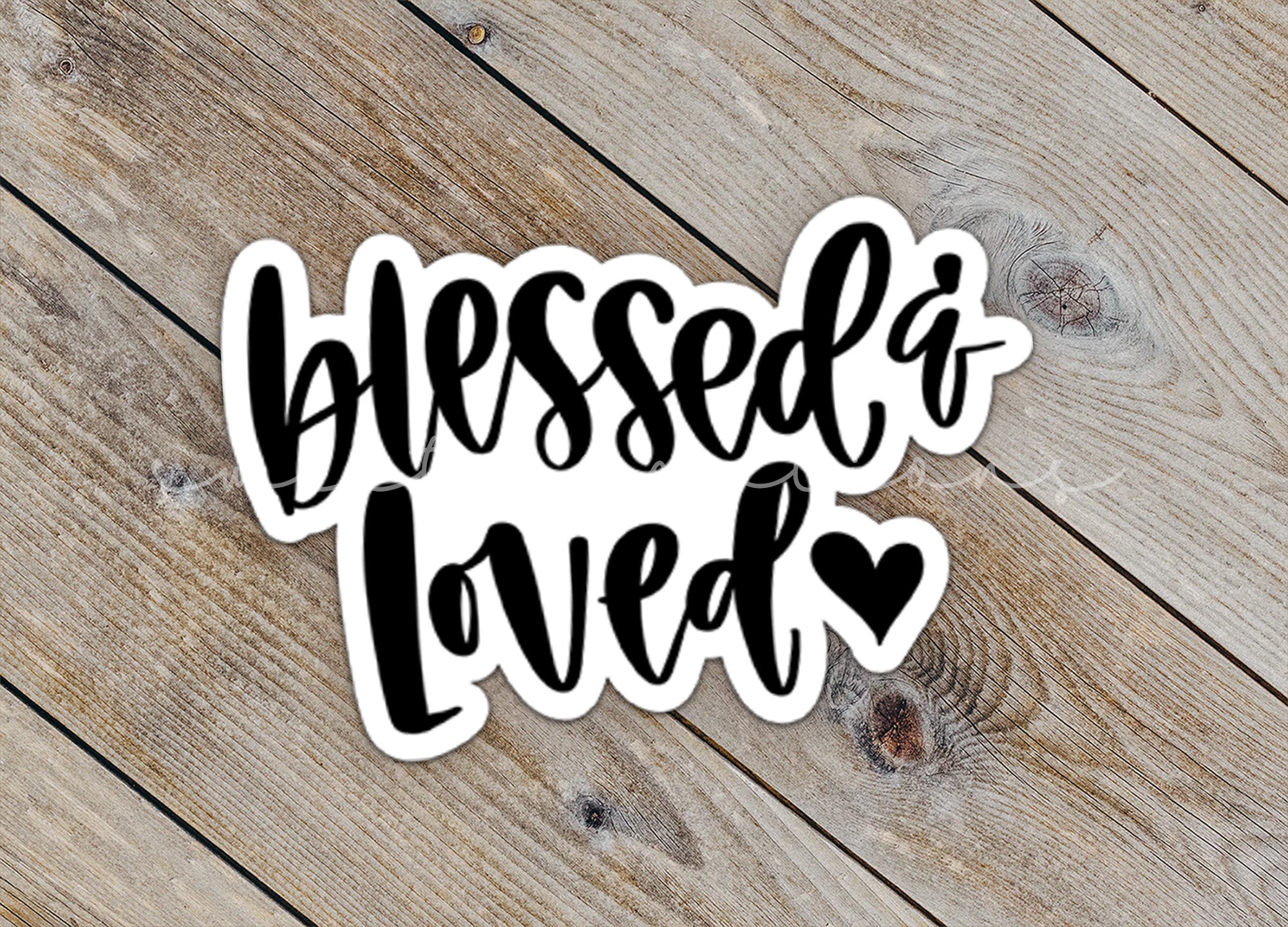 a sticker that says, blessed loved