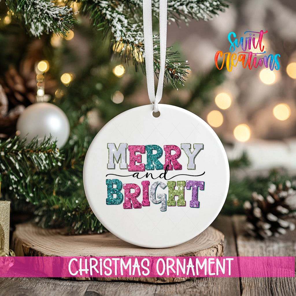 A white Christmas ornament with the text "MERRY AND BRIGHT" in colorful letters is hanging from a tree branch.