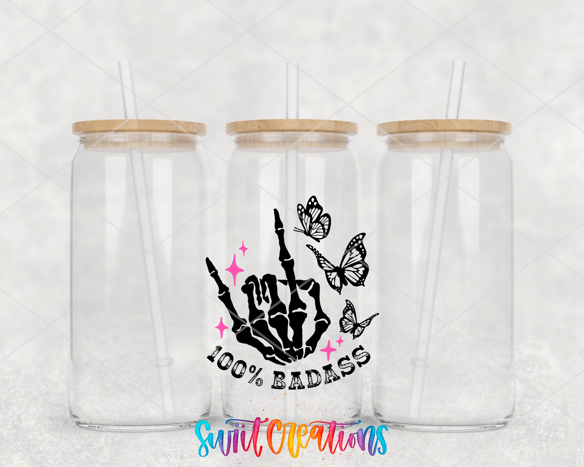 two clear tumblers with wooden lids and a sticker of a hand holding a