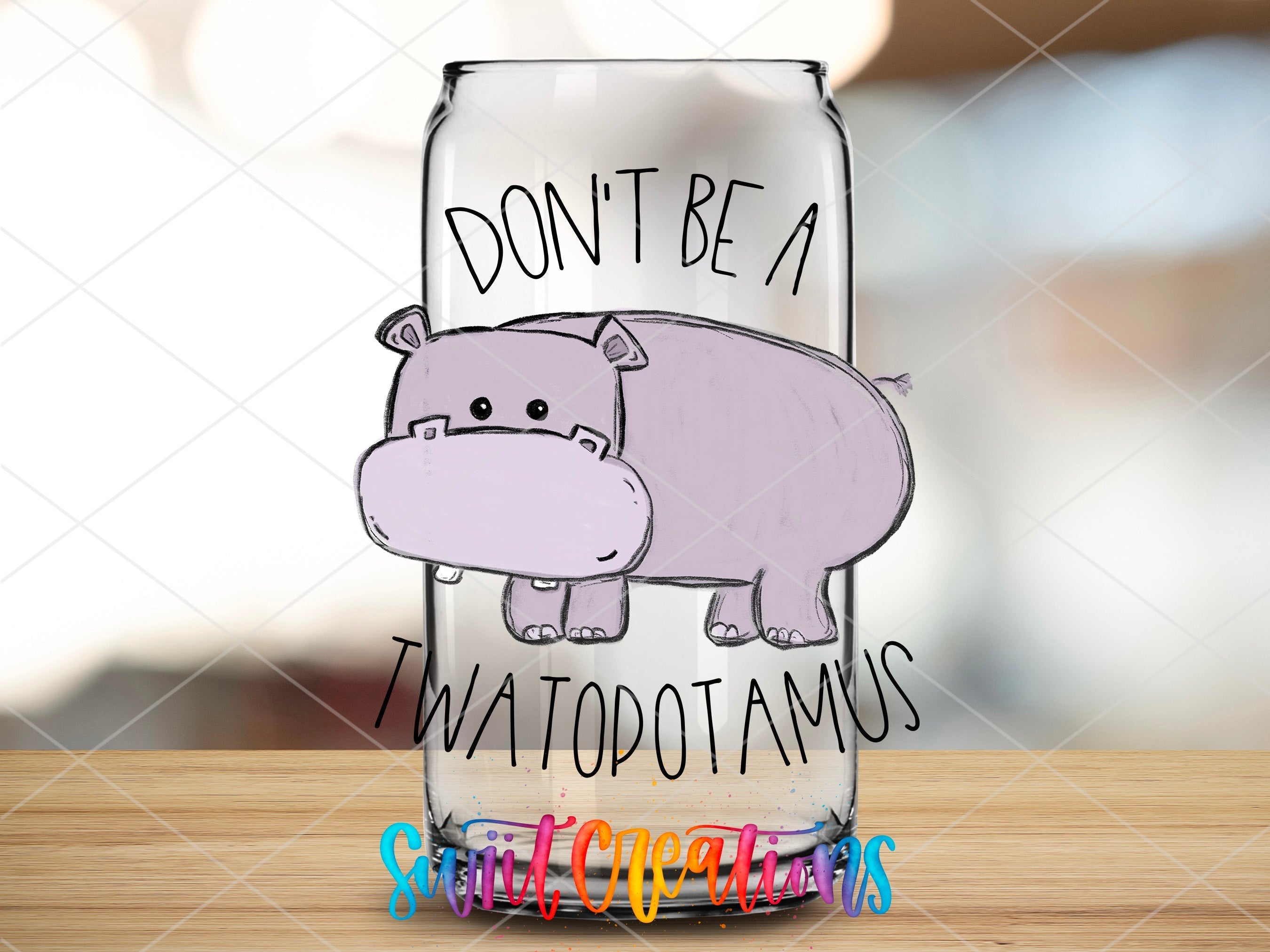 a glass with a drawing of a hippo on it
