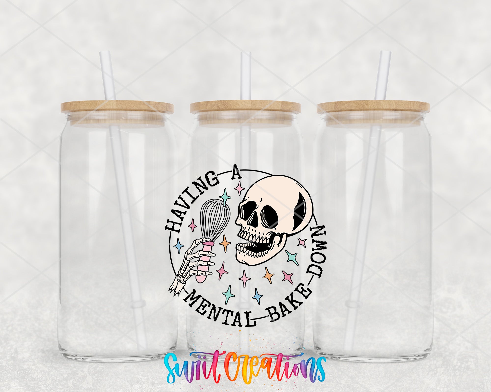 two clear tumblers with a skeleton holding a whisk