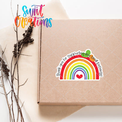 a box with a rainbow sticker on it