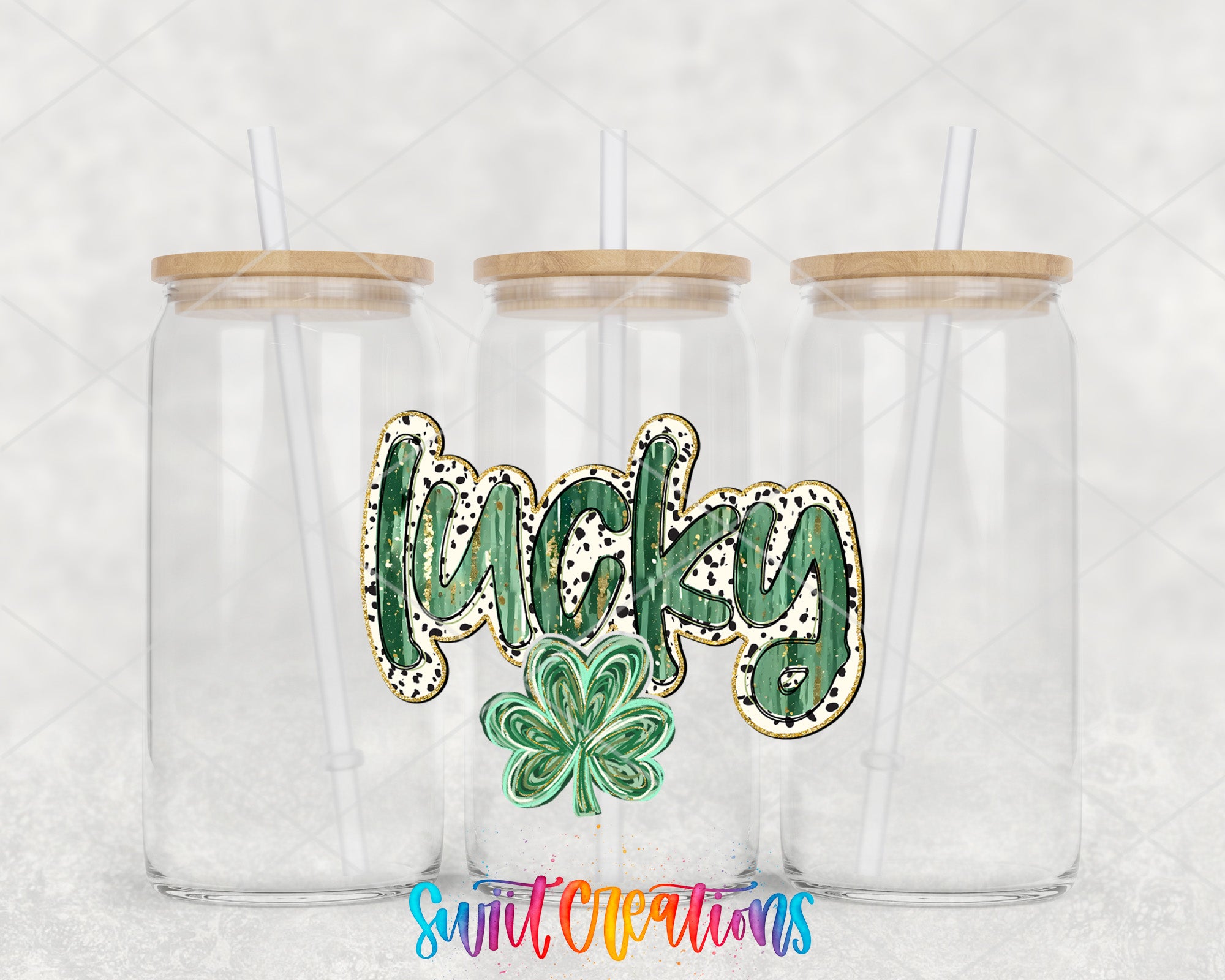 a couple of clear cups with shamrocks on them