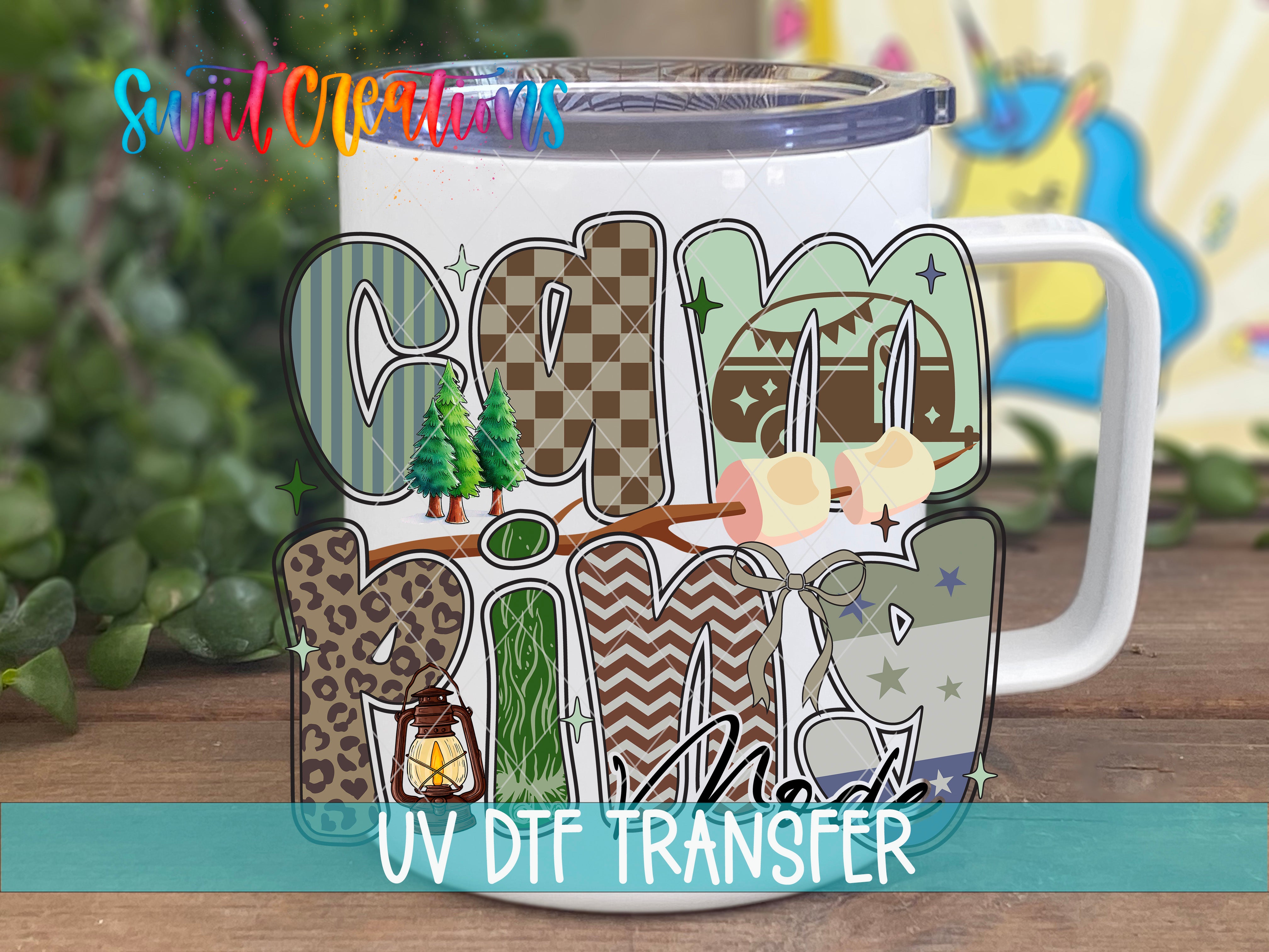 A white mug with a colorful, hand-drawn design featuring various elements such as trees, stars, and geometric shapes.