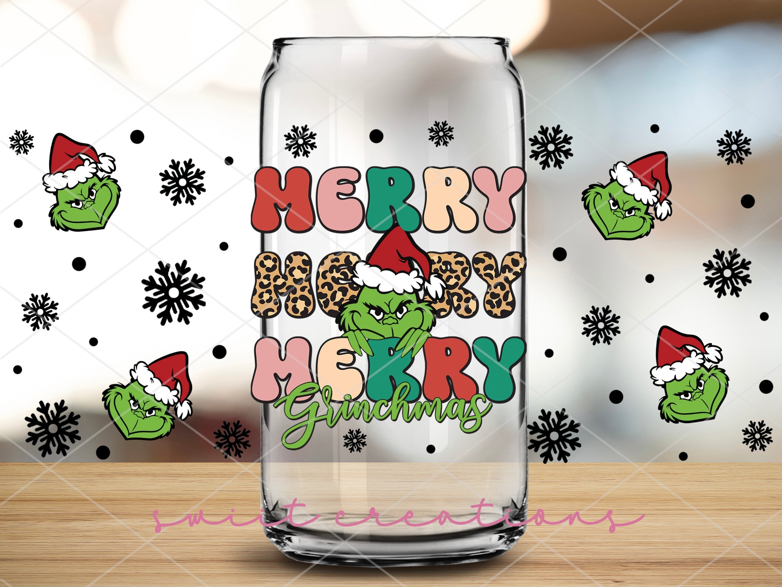 a glass with a christmas message on it