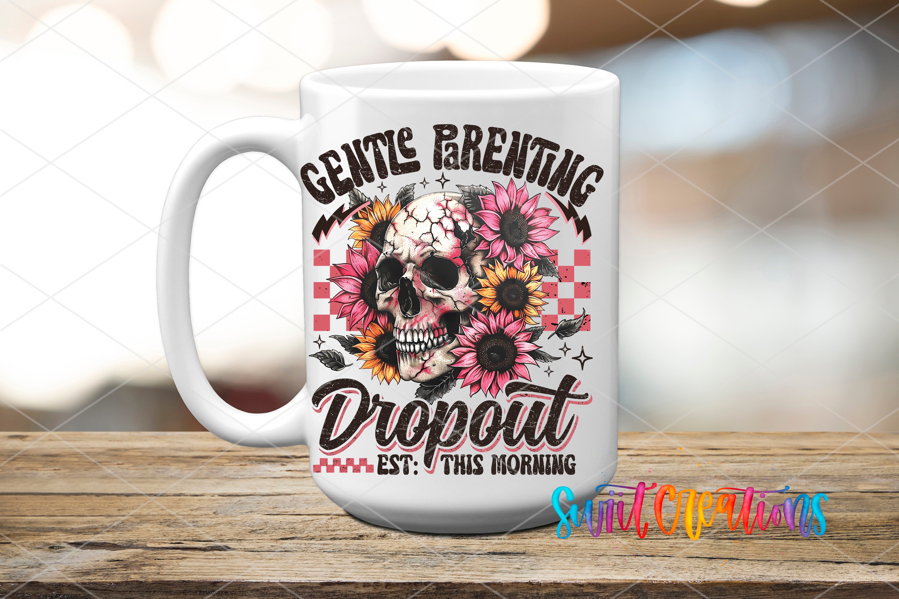 A white ceramic mug with a colorful design featuring a skull and sunflowers, along with the text "GENTLE PARENTING DROPOUT EST. THIS MORNING" printed on it.