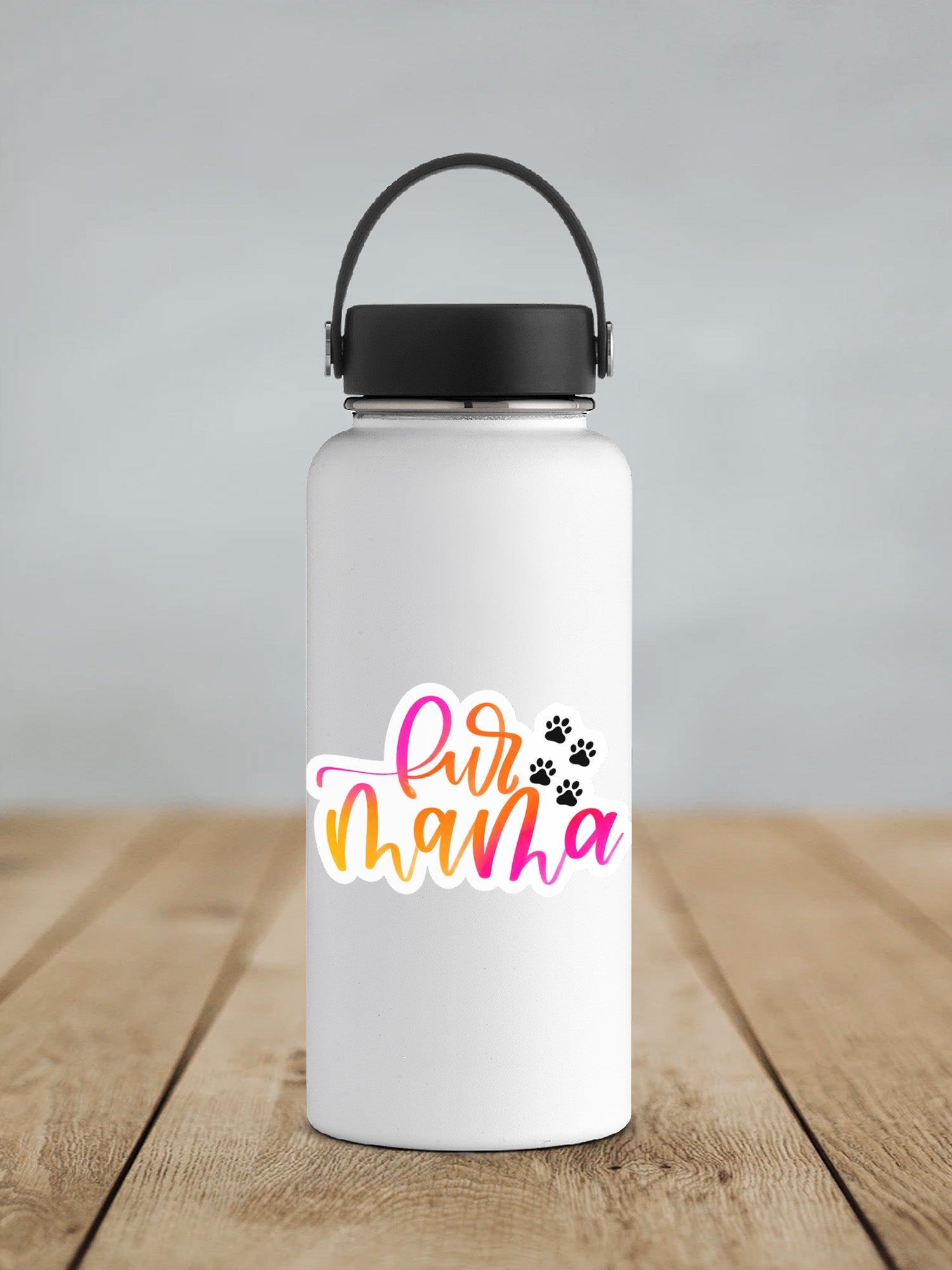 a white water bottle with a black lid on a wooden table